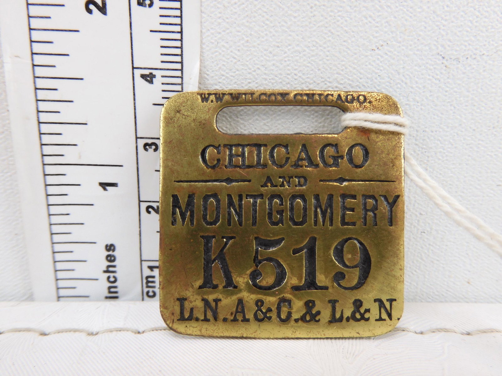 railroad brass luggage tag CHICAGO AND MONTGOMERY K519,: railroad brass luggage tag CHICAGO AND MONTGOMERY K519, LNA&C & L&N. nice shape and good lettering , 1-3/8" square.