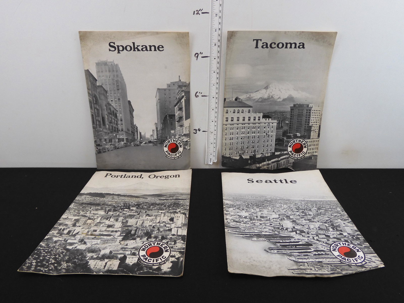 4 NORTHERN PACIFIC- YELLOW PARK LINE brochures-: 4 NORTHERN PACIFIC- YELLOW PARK LINE brochures- SEATTLE, PORTLAND, TACOMA, SPOKANE. References to the Air Conditioned, Roller Bearing NORTH COAST LIMITED but dated 4-39. Pre-war type heavyweight train