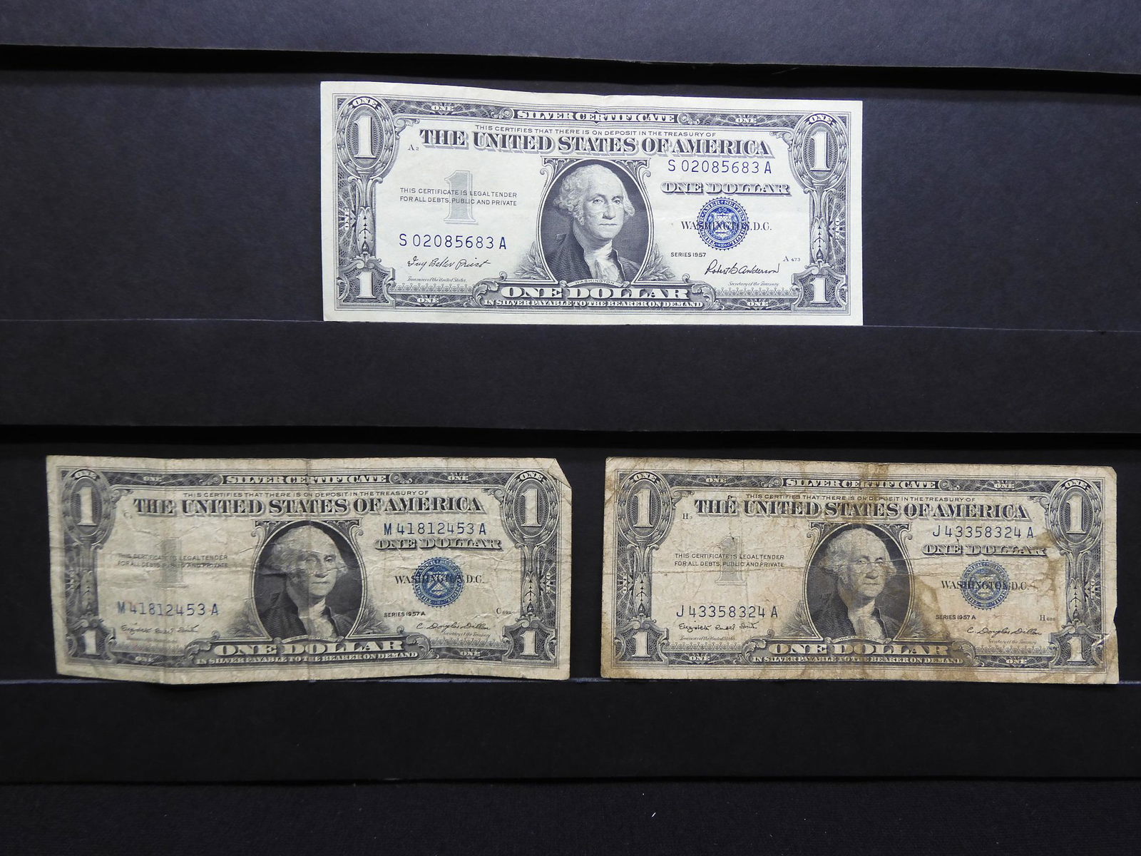Group of Three 1957 $1 Blue Seal Silver Certificates. (1 of 6)