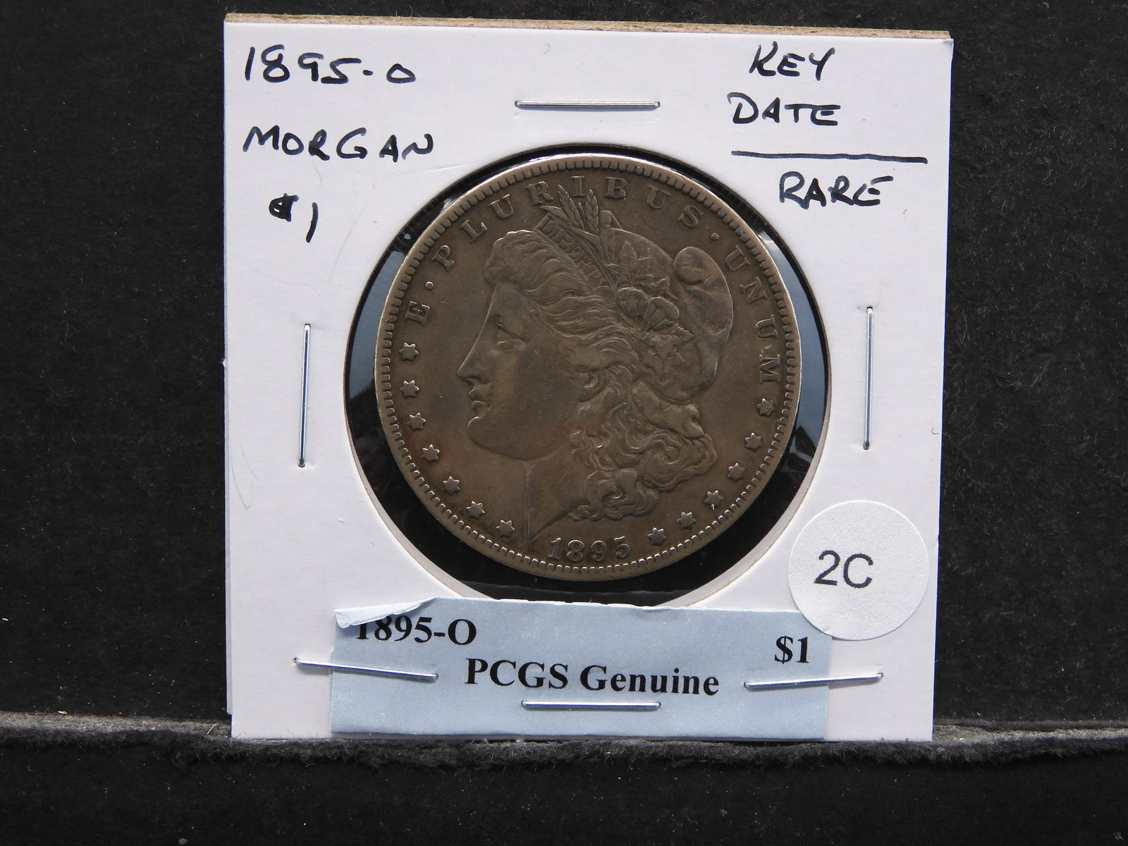 1895-O Morgan $1.  Key Date.  Rare.  PCGS Genuine $1. (1 of 3)