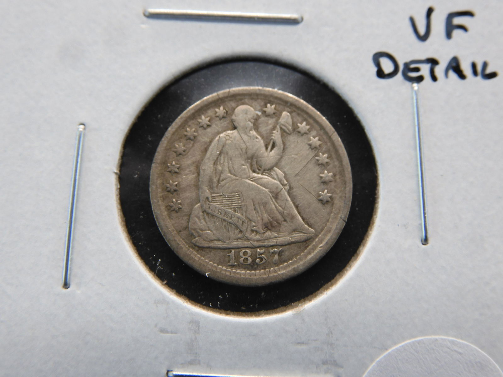 1857 Seated 1/2 Dime.  VF Details. (1 of 3)