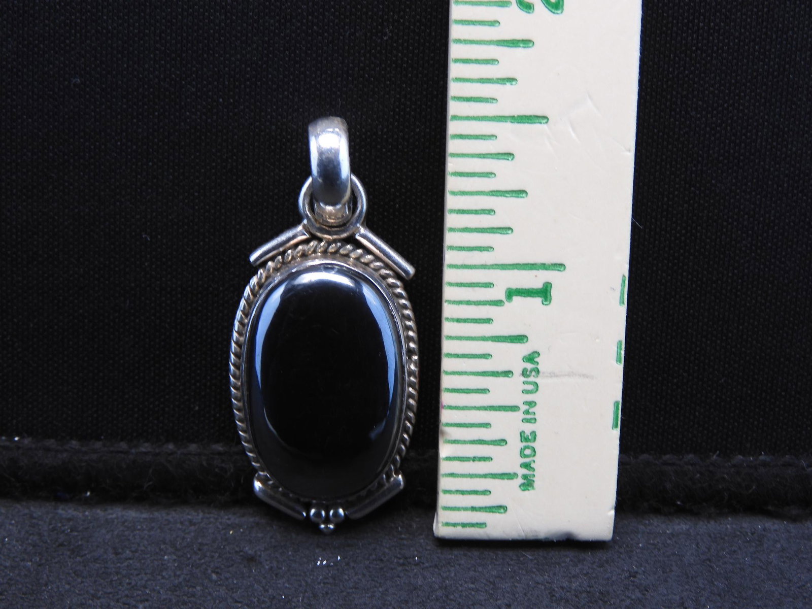Sterling Locket with polished oval black stone.: Sterling Locket with polished oval black stone.