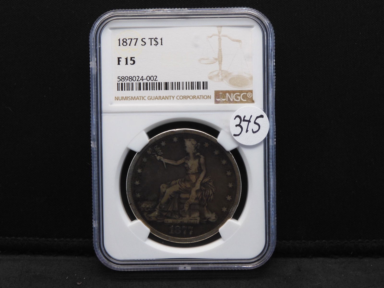 1877-S US Trade Dollar NGC FINE 15 Nice Color (1 of 4)