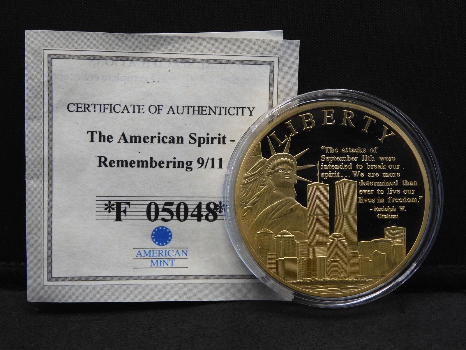 The American Spirit-Remembering 9/11 Medal from the: The American Spirit-Remembering 9/11 Medal from the American Mint. Copper layered in 24K gold. Proof. Has COA