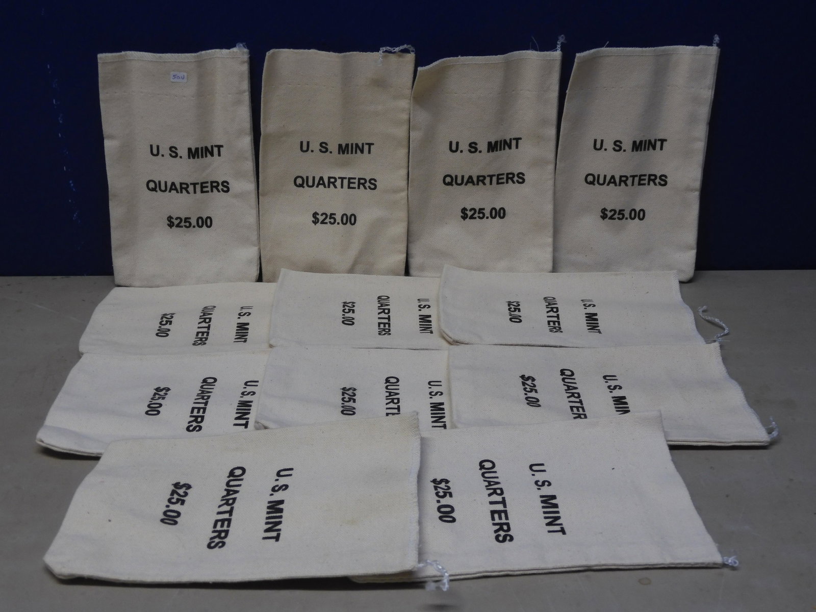 12- Seldom seen 25 Dollar U.S. Mint Quarter Bags.: 12- Seldom seen 25 Dollar U.S. Mint Quarter Bags.
