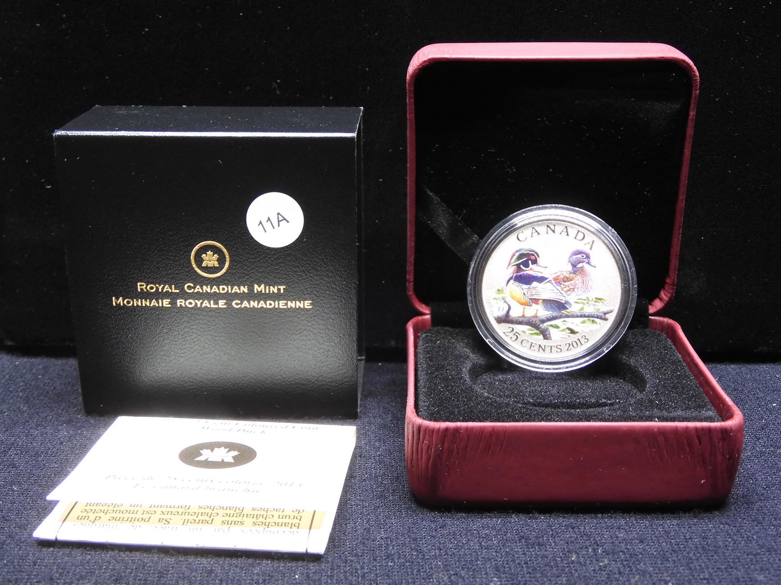 2013 Canada coper nickel 25 Cents. This colored coin: 2013 Canada coper nickel 25 Cents. This colored coin features The Wood Duck. Specimen quality in original box with COA. Mintage: 25,000.