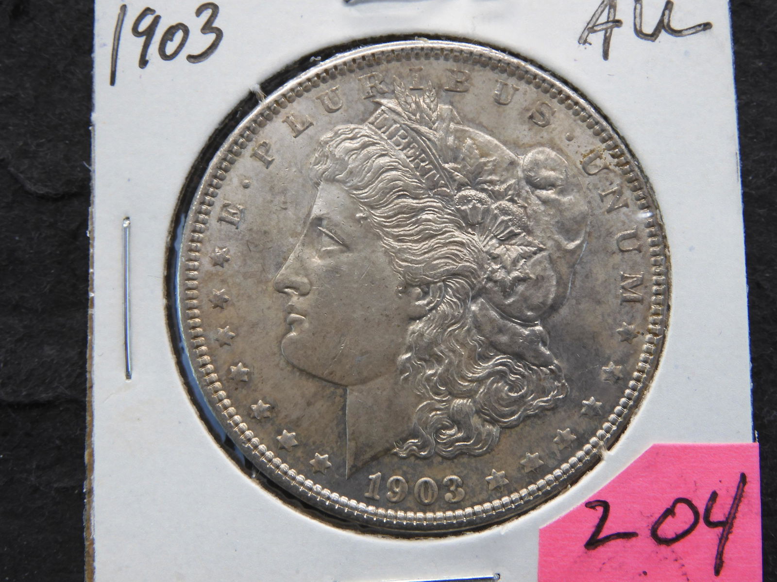 1903 Morgan Dollar AU. Toned. (1 of 3)