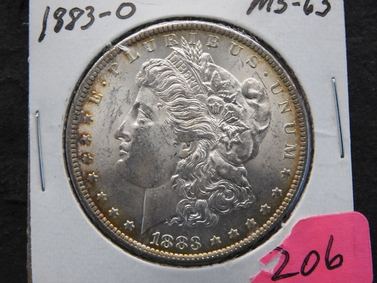 1883-O Morgan Dollar MS63. Toned. (1 of 3)