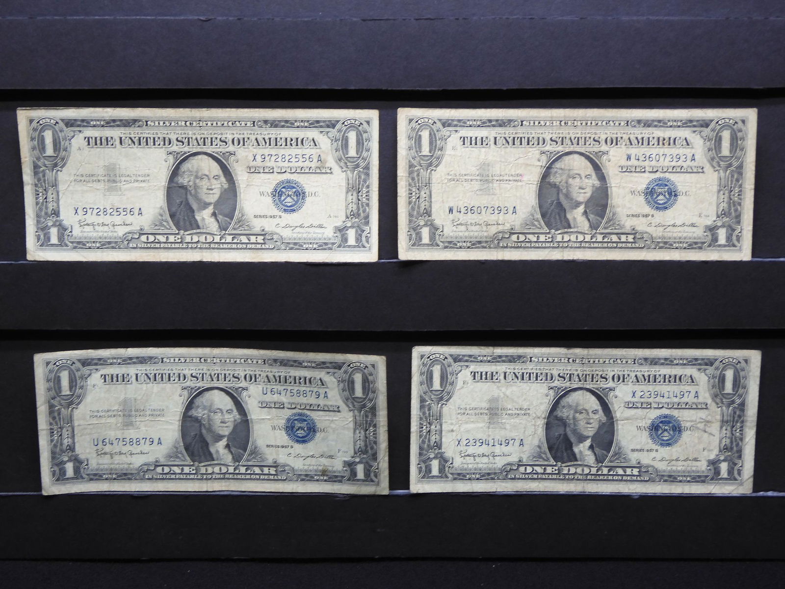 Four 1957-B $1 Blue Seal Silver Certificates. (1 of 6)