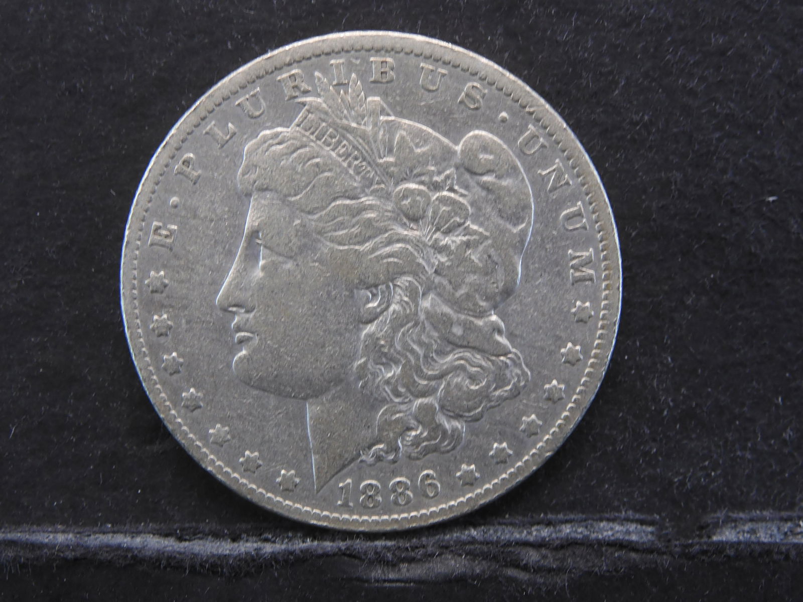 1886-O MORGAN SILVER DOLLAR 90% SILVER (1 of 2)