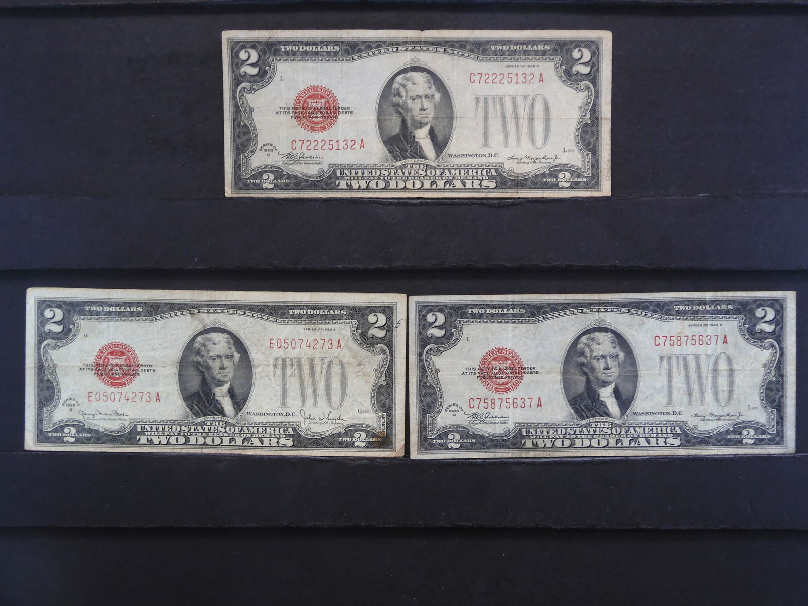 2 - 1928D & 1 - 1928G $2 Red Seal Notes.  Circulated. (1 of 3)