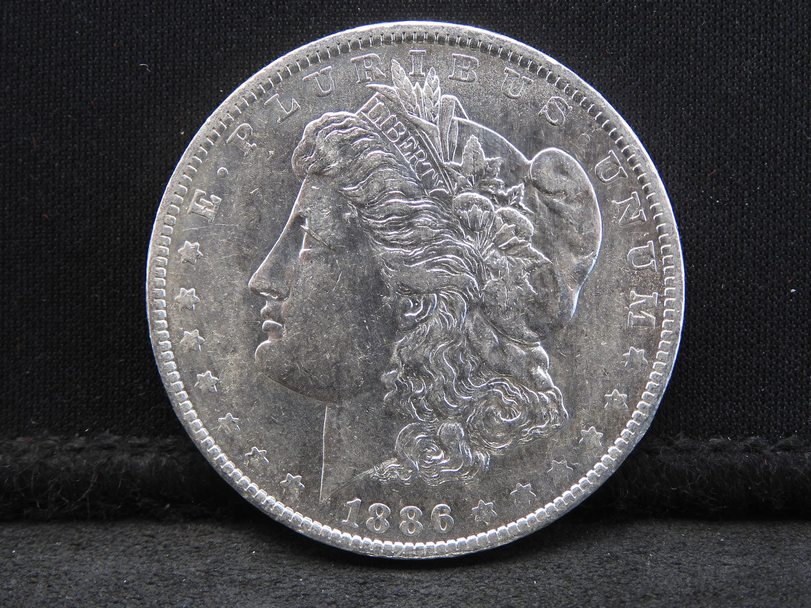 1886-O MORGAN AU/BU SILVER DOLLAR 90% SILVER: 1886-O MORGAN AU/BU SILVER DOLLAR 90% SILVER