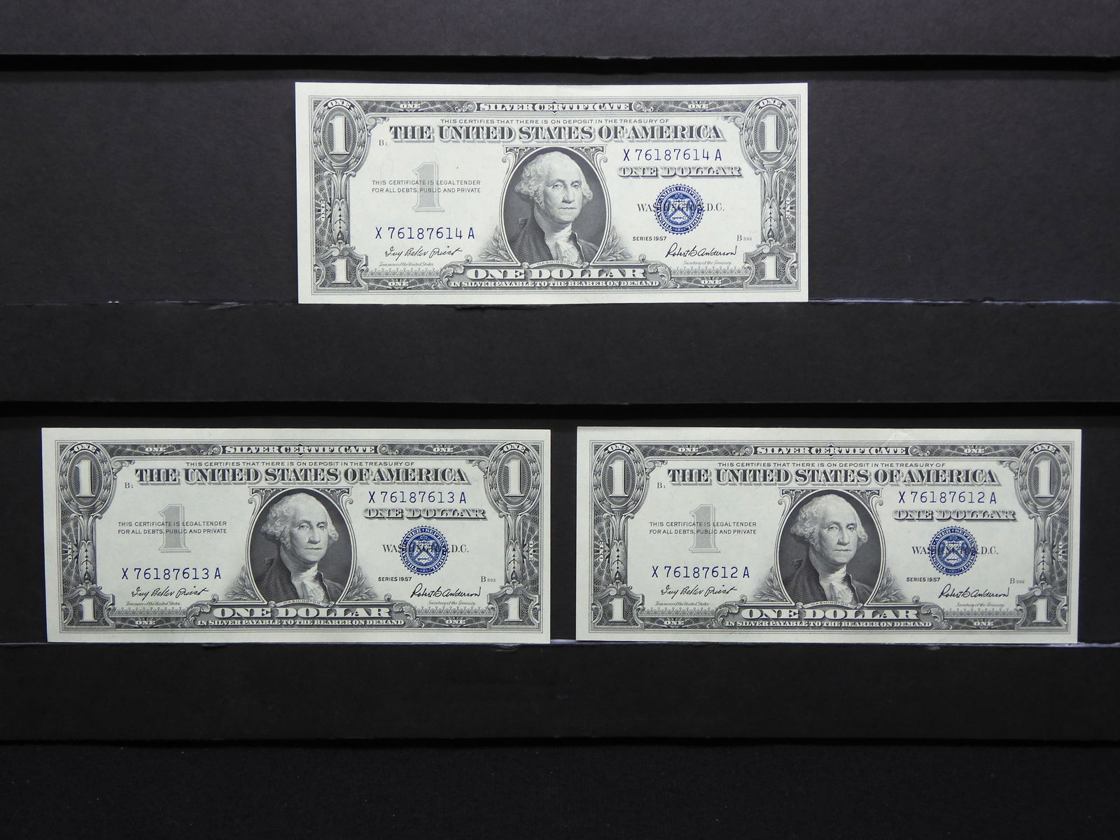 Three 1957 Crisp Uncirculated $1 Blue Seal Silver Certificates.  Consecutive Serial Numbers. (1 of 6)