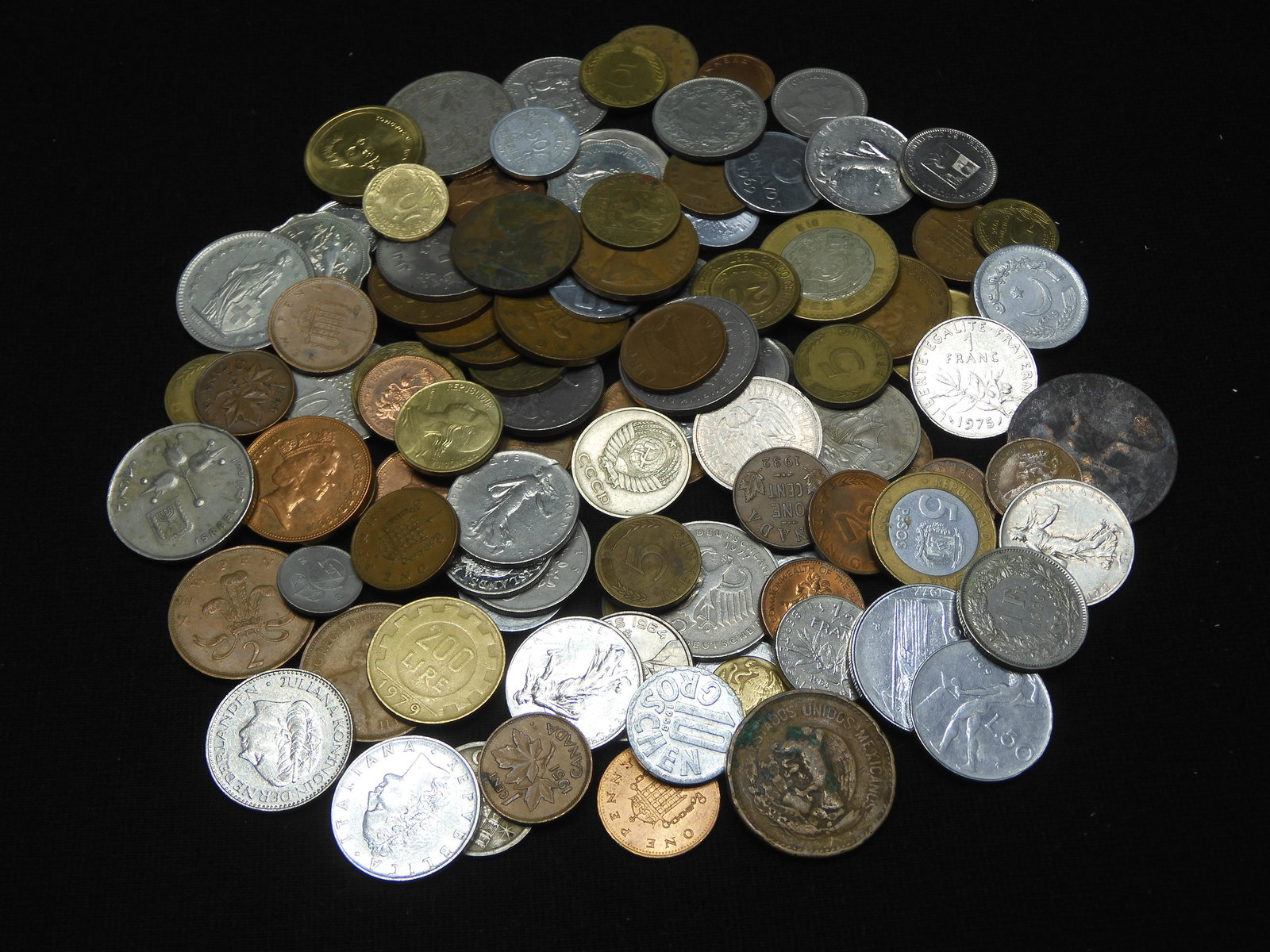 One-pound foreign coins.  Very nice mix. (1 of 5)