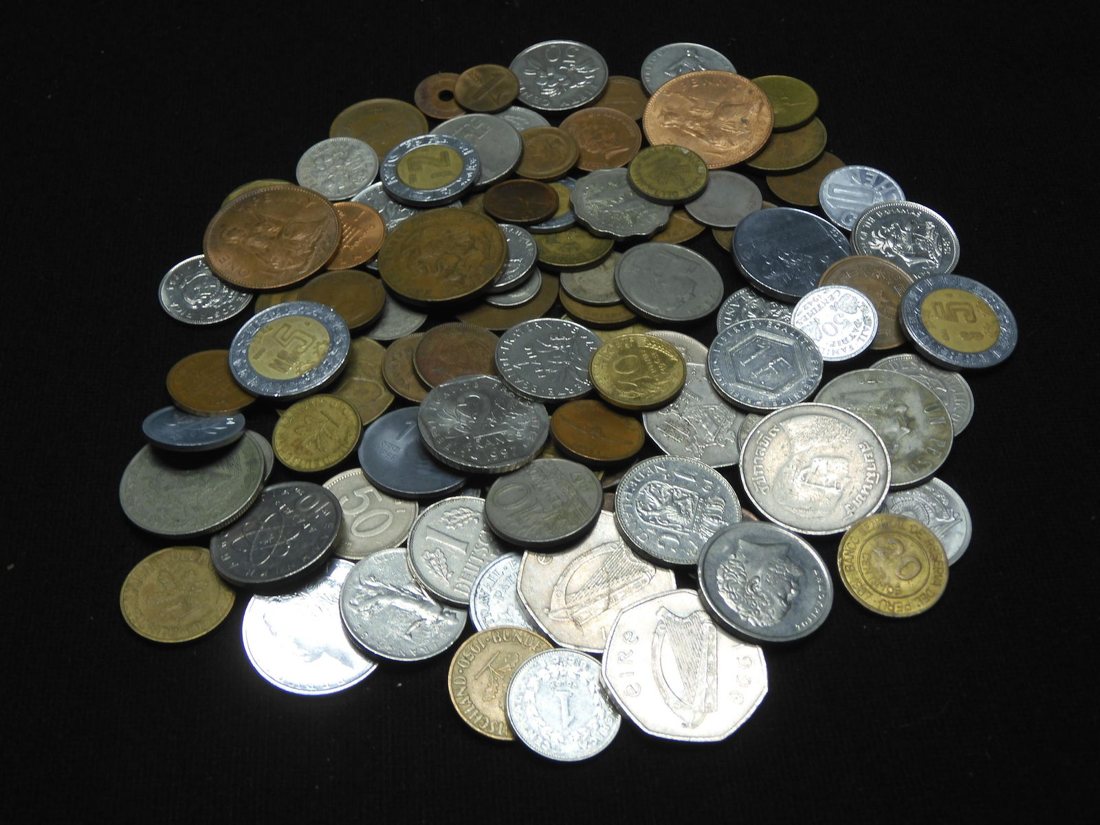 One-pound foreign coins.  Very nice mix. (1 of 5)
