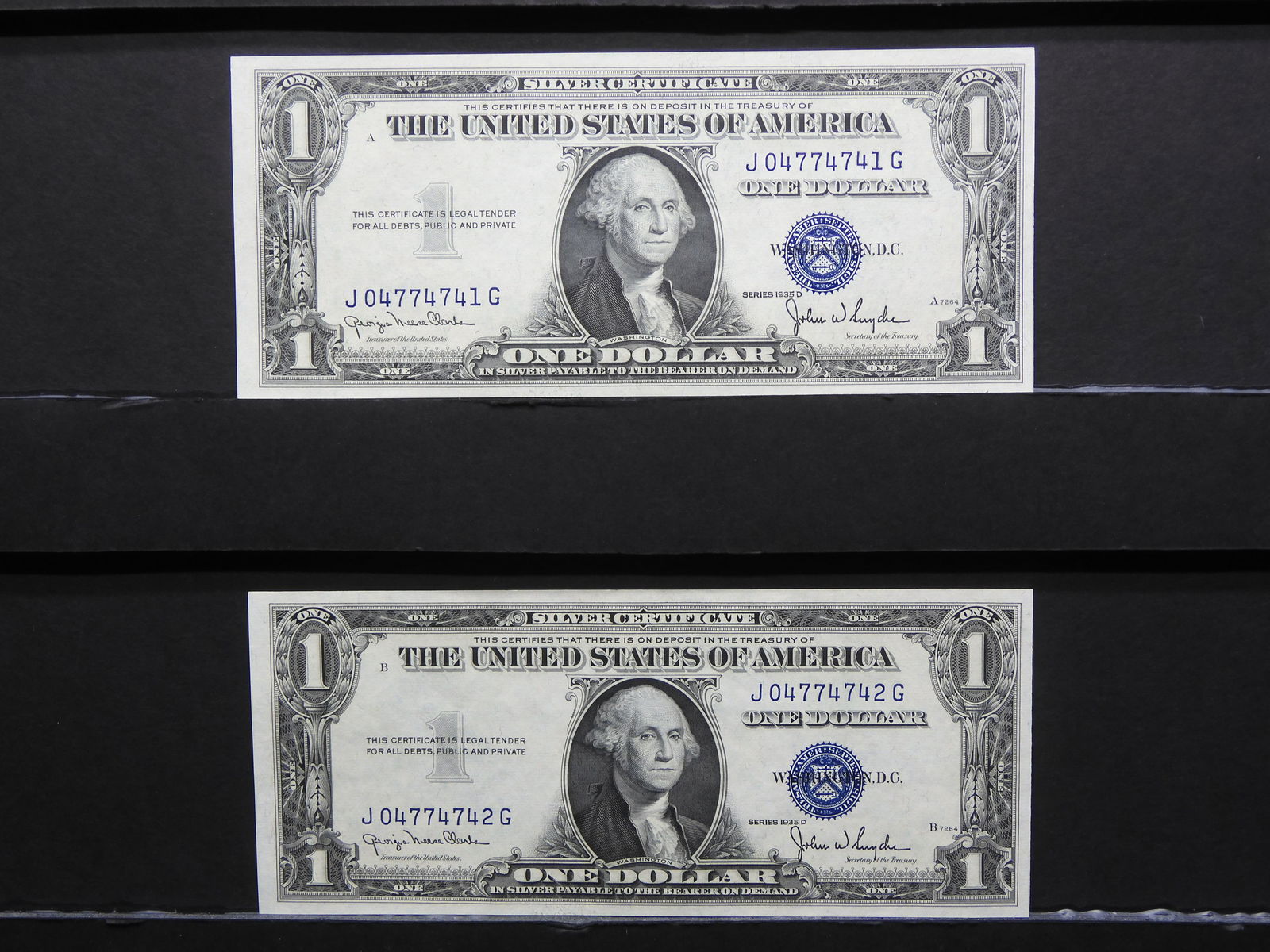 (2) Consecutive serial number 1935-D $1 silver certificates.  GEM Crisp Uncirculated. (1 of 6)