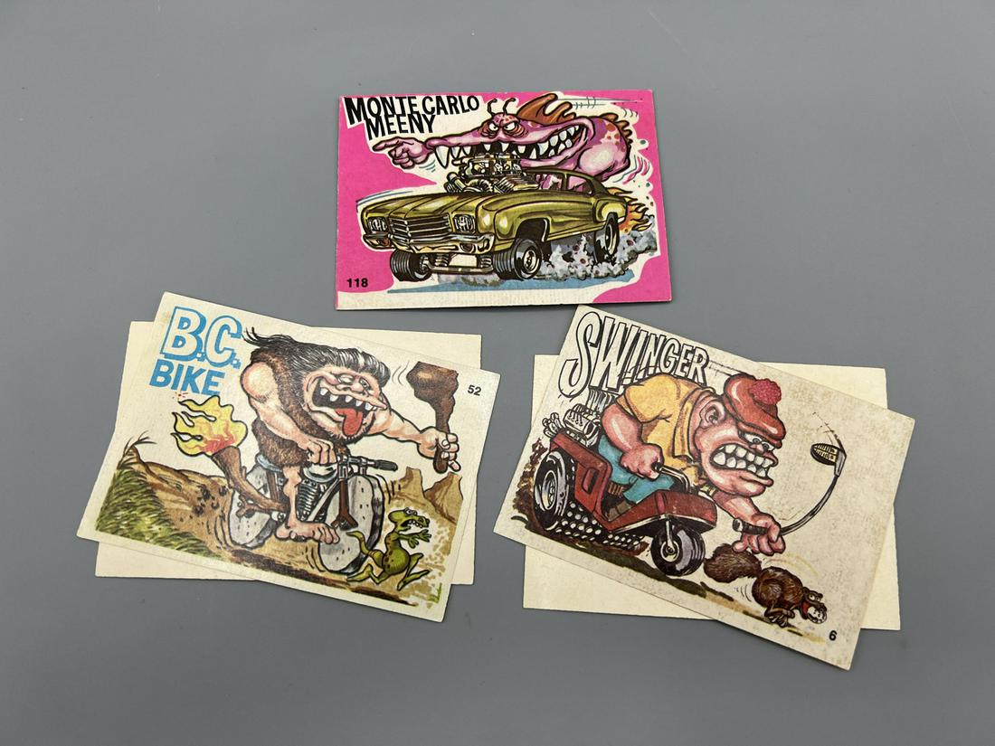 Lot of (3) 1969-1973 Donruss Odd Rods Cards - Monte Carlo Meeny, B.C. Bike, Swinger - 2 of the: Lot of (3) 1969-1973 Donruss Odd Rods Cards - Monte Carlo Meeny, B.C. Bike, Swinger - 2 of the stickers have released from the backing