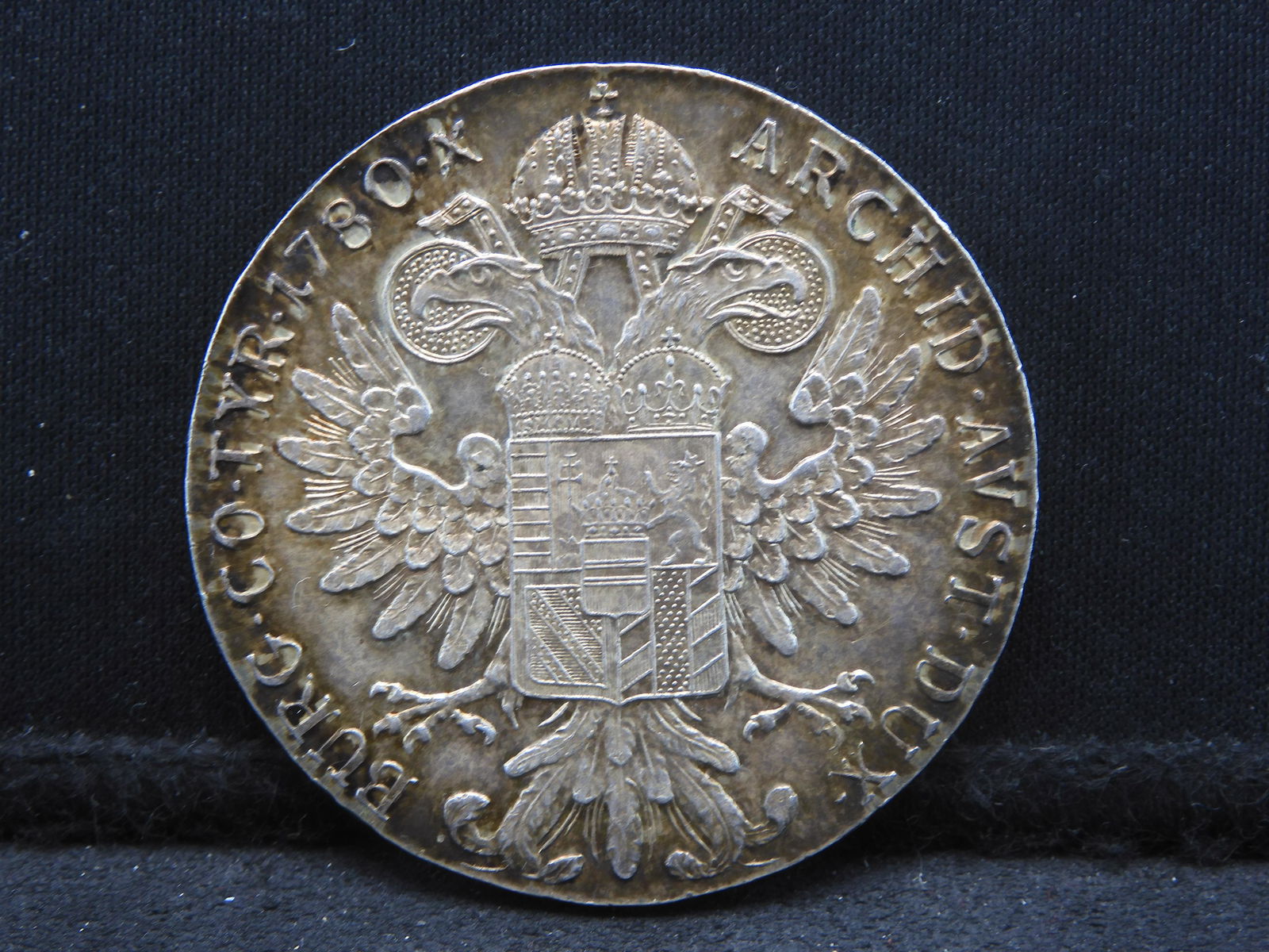 1780 Uncirculated Austria Thaler 83.5% Silver Coin.  REV: Portrait Maria Theresa. (1 of 3)