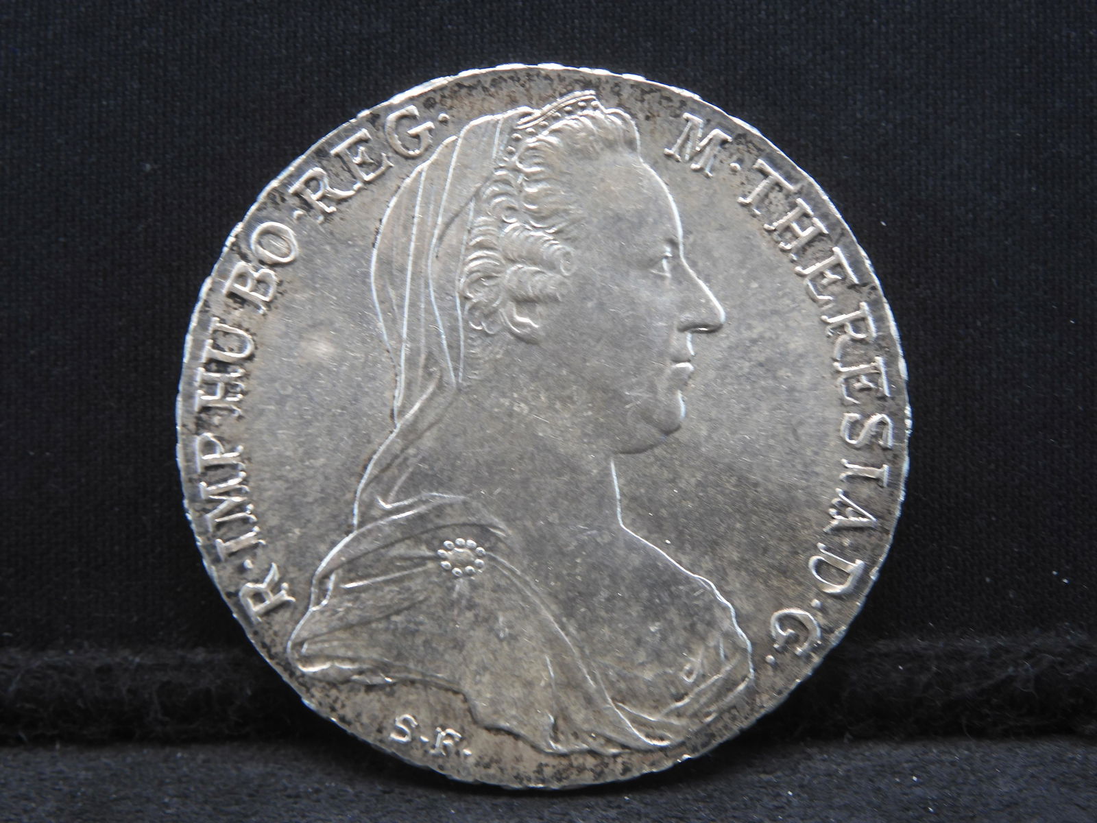 1780 Uncirculated Austria Thaler 83.5% Silver Coin.  REV: Portrait Maria Theresa. (1 of 3)