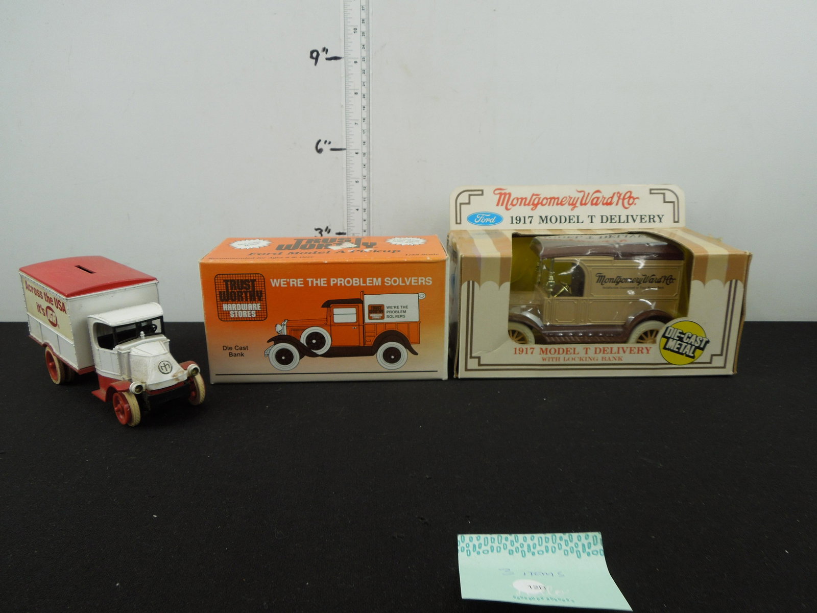 Lot of 3 Truck Banks; Ertl Montgomery Ward 1917 Model T Delivery, Ertl IGA Mack, & Spec-Cast: Lot of 3 Truck Banks; Ertl Montgomery Ward 1917 Model T Delivery, Ertl IGA Mack, & Spec-Cast Trustworthy 1929 Model A Pickup