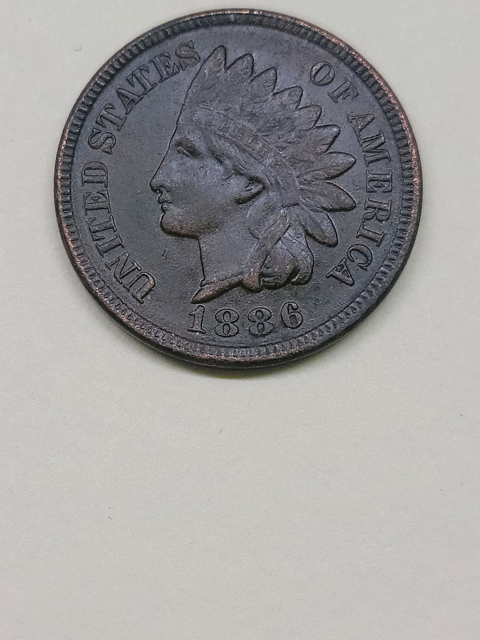 1886 Indian Cent.  Scarce Type two.  AU detail.  Very strong Liberty. (1 of 3)
