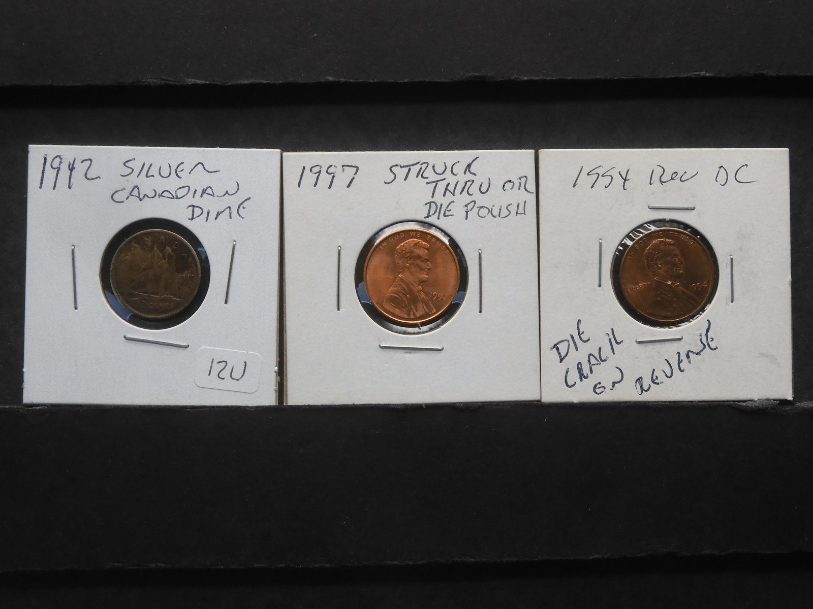 2 Error Cents and a Silver 1942 Canadian Dime. 1994 Cent with reverse die crack and 1997 struck thru: 2 Error Cents and a Silver 1942 Canadian Dime. 1994 Cent with reverse die crack and 1997 struck thru or die polish. 