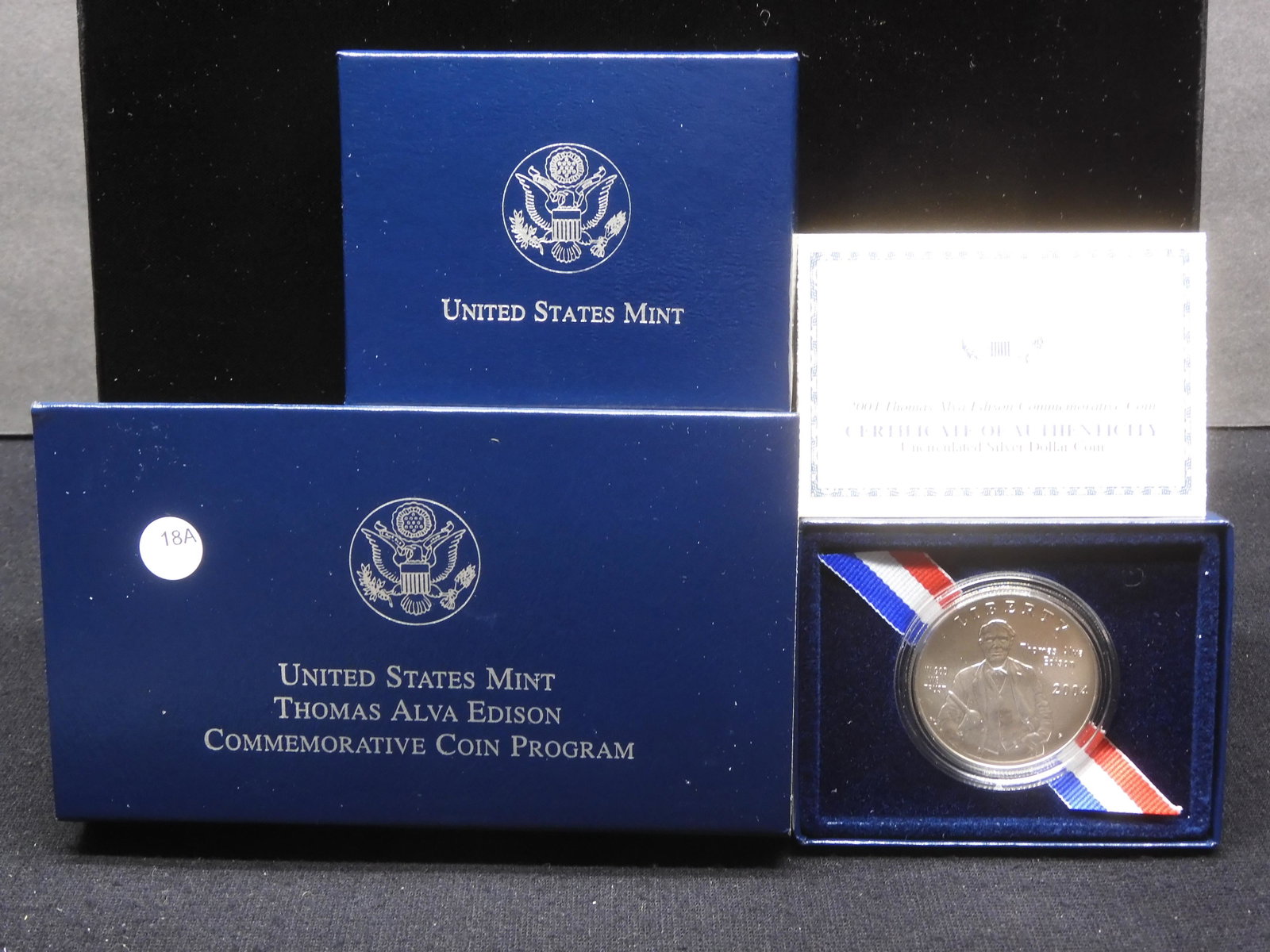 2004 P Thomas Edison Commemorative $1. GEM Uncirculated in original box with COA. 90% Silver: 2004 P Thomas Edison Commemorative $1. GEM Uncirculated in original box with COA. 90% Silver