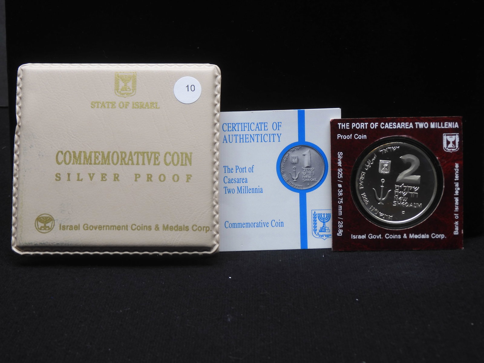 1995 Israel .925 silver 2 Sheqel. Port of Caesarea Two Millennia. GEM Proof in original box with: 1995 Israel .925 silver 2 Sheqel. Port ofCaesarea Two Millennia. GEM Proof inoriginal box with COA. Mintage a mere5,000. 28.8 Grams.