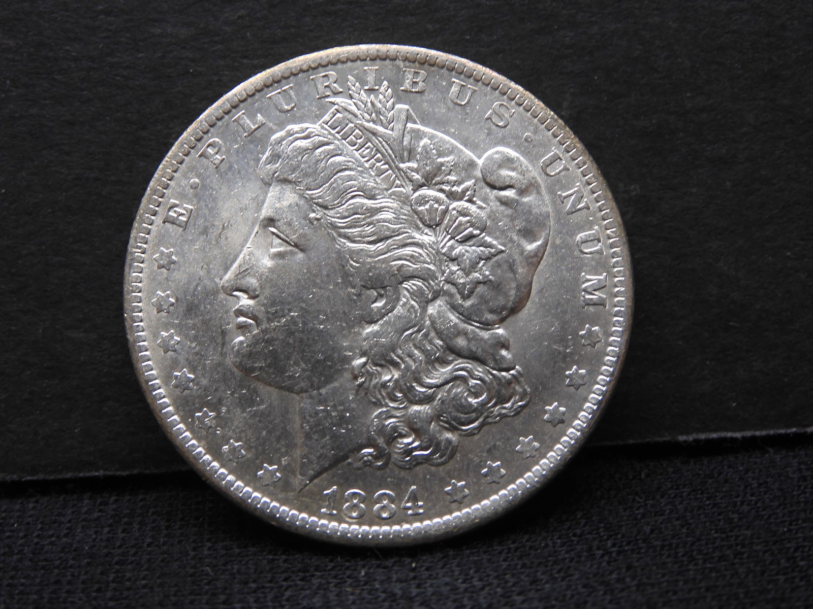 1884-O Morgan Dollar.  Higher grade. (1 of 2)