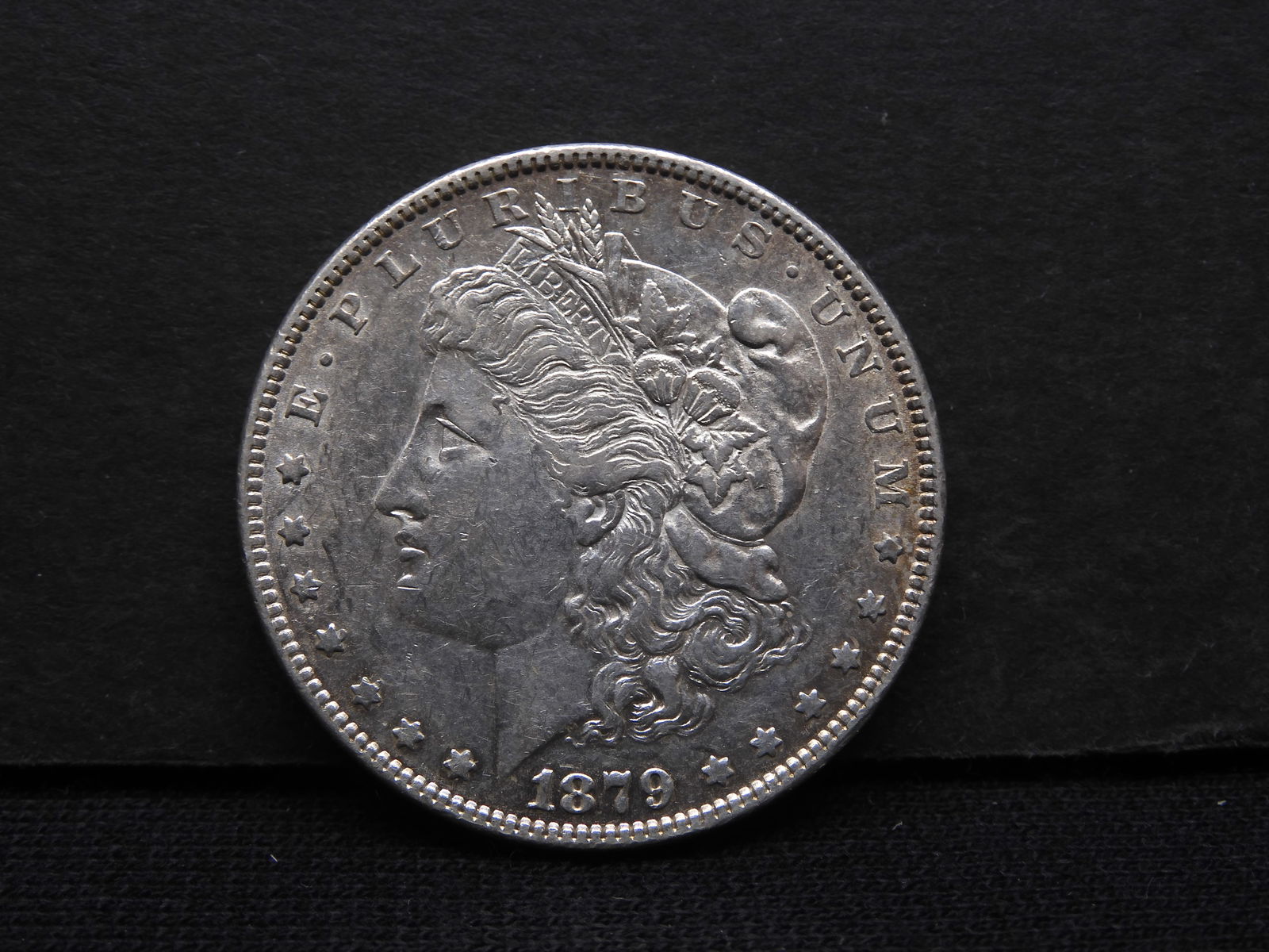 1879 Morgan Dollar.  Nice detail, some luster. (1 of 3)