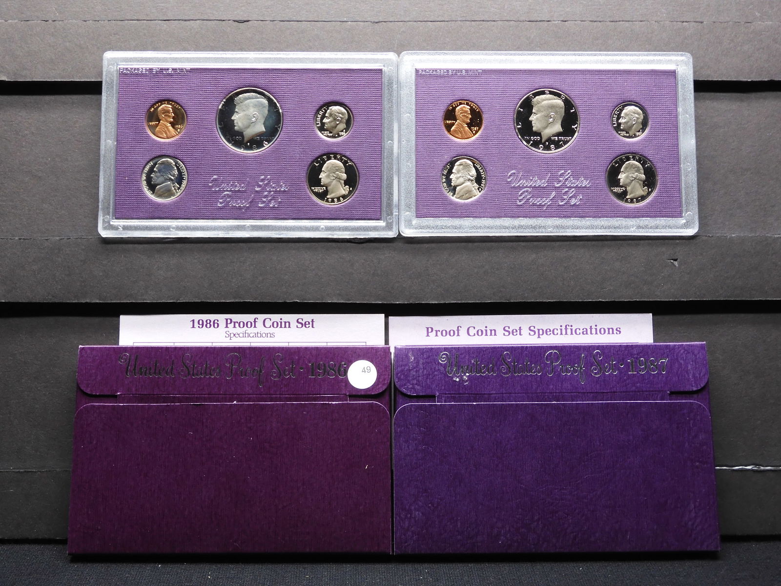 (2) Five Piece US Proof sets in original packing:  1986-S and 87-S.  GEM (1 of 6)