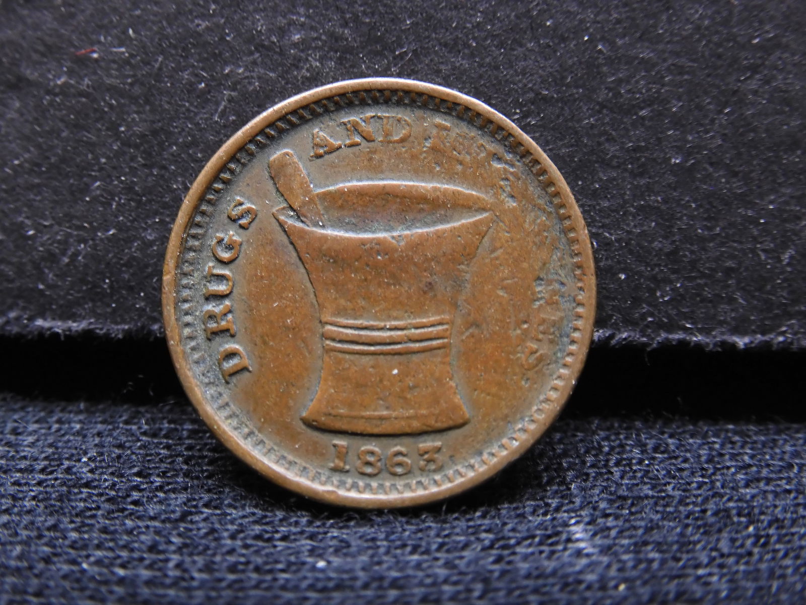 1863 U.S. Civil War Token.  REV: S.N. Todd & Co, Druggists & Stationers.  OBV: Mortar & Pestle. (1 of 2)