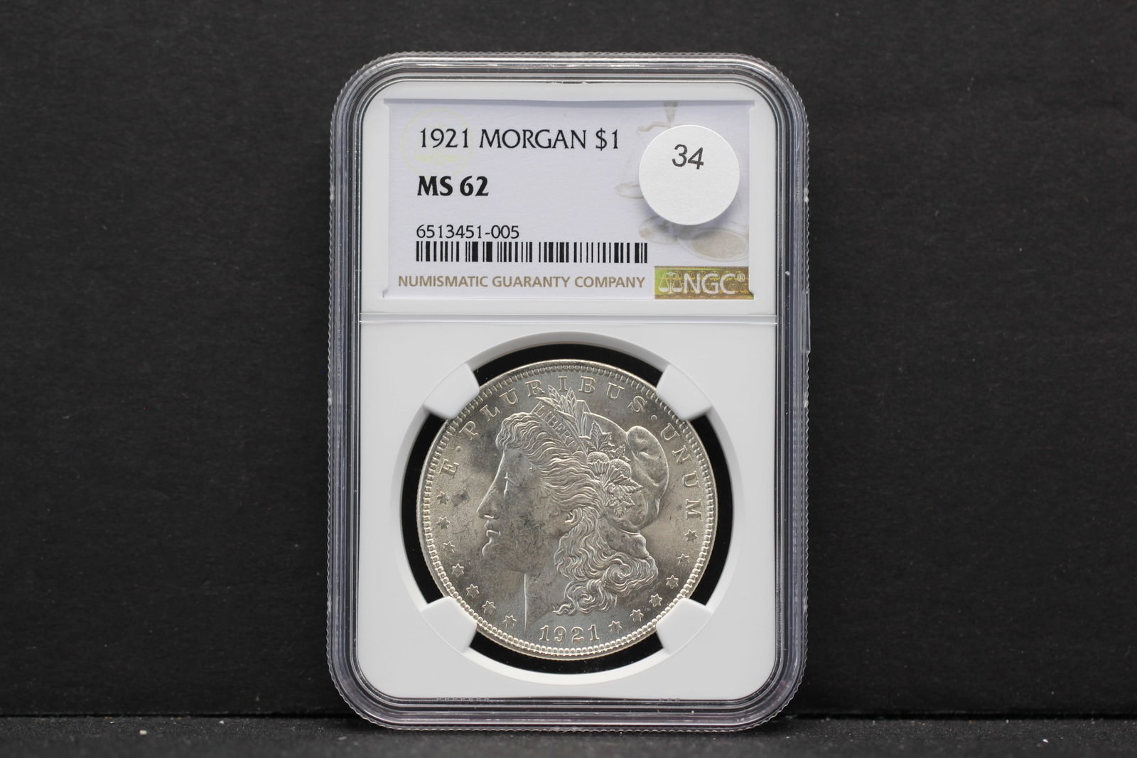 1921 Morgan $1. Slabbed by NGC, top tier grader, as MS 62. White coin with nice luster.: 1921 Morgan $1. Slabbed by NGC, top tier grader, as MS 62. White coin with nice luster.