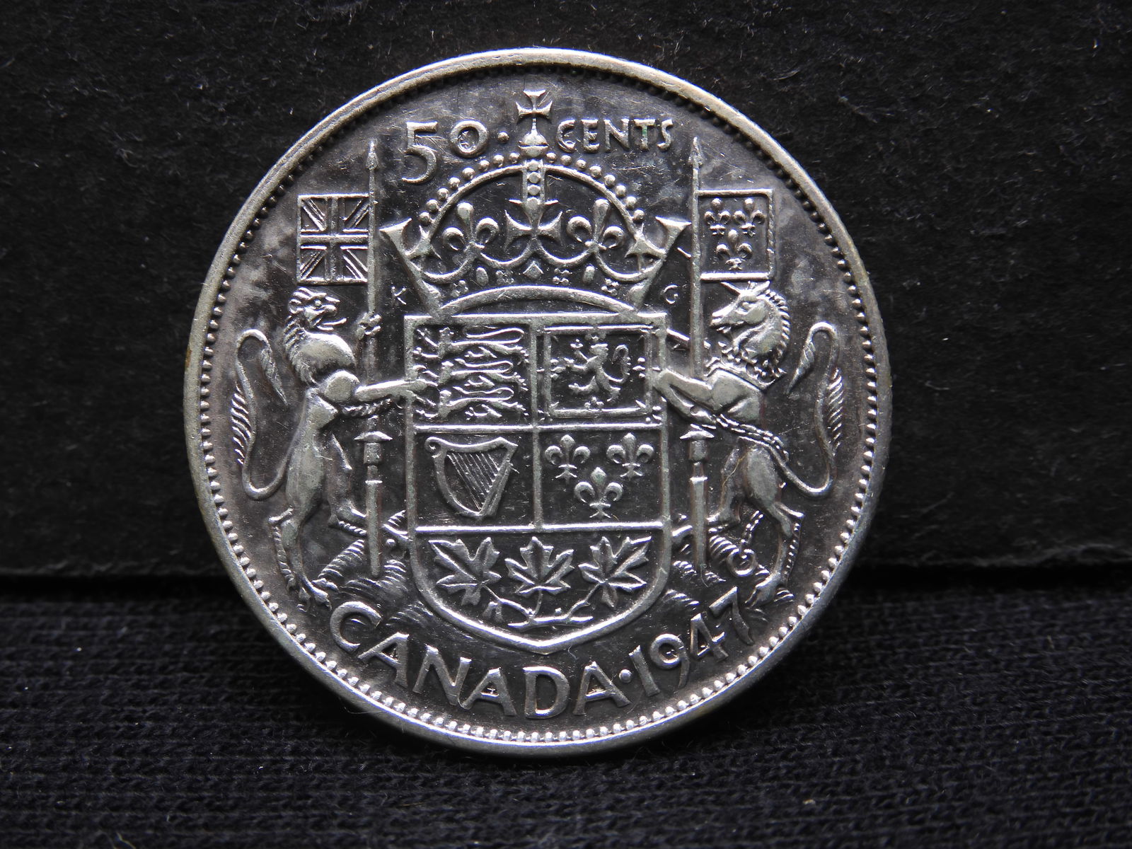 1947 Canada Curved 7 Silver Half.  Nice shape. (1 of 3)