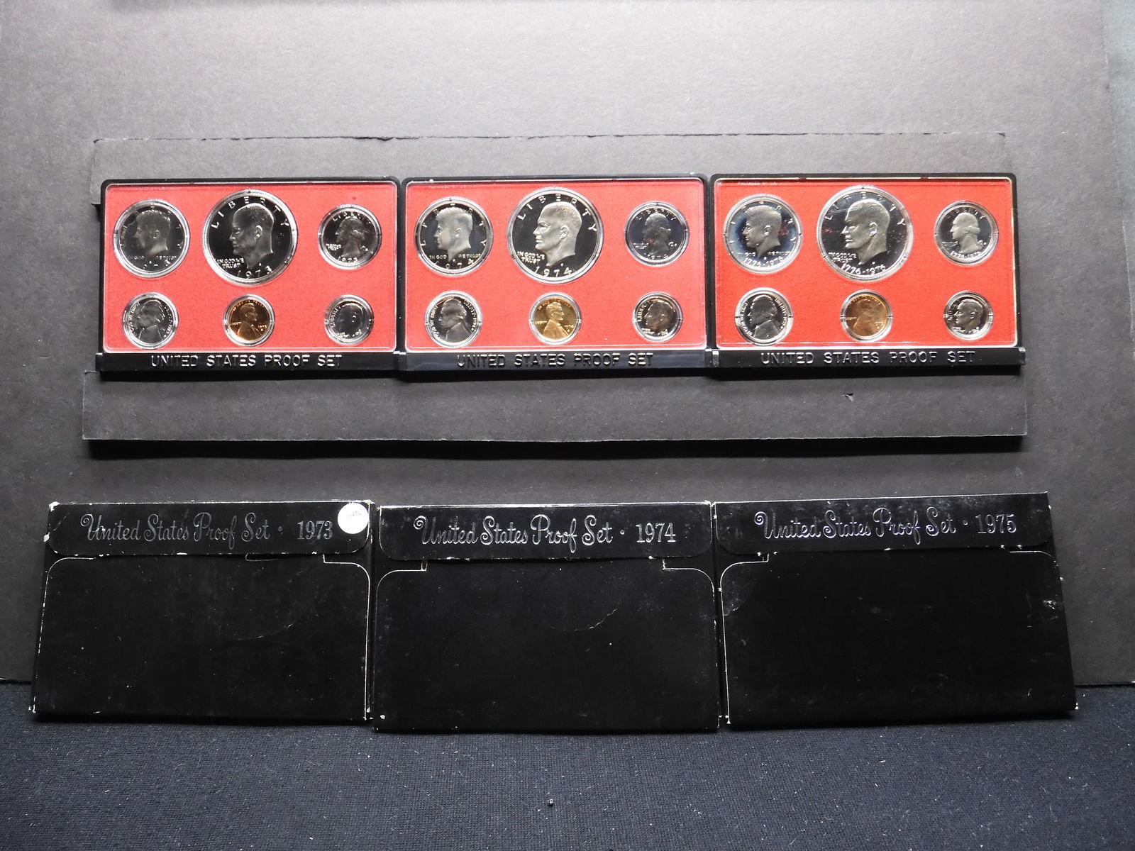 1973-S 1974-S 1975-S United States Proof Sets With Original Gov't Packaging. 18 Coins.: 1973-S 1974-S 1975-S United States Proof Sets With Original Gov't Packaging. 18 Coins.