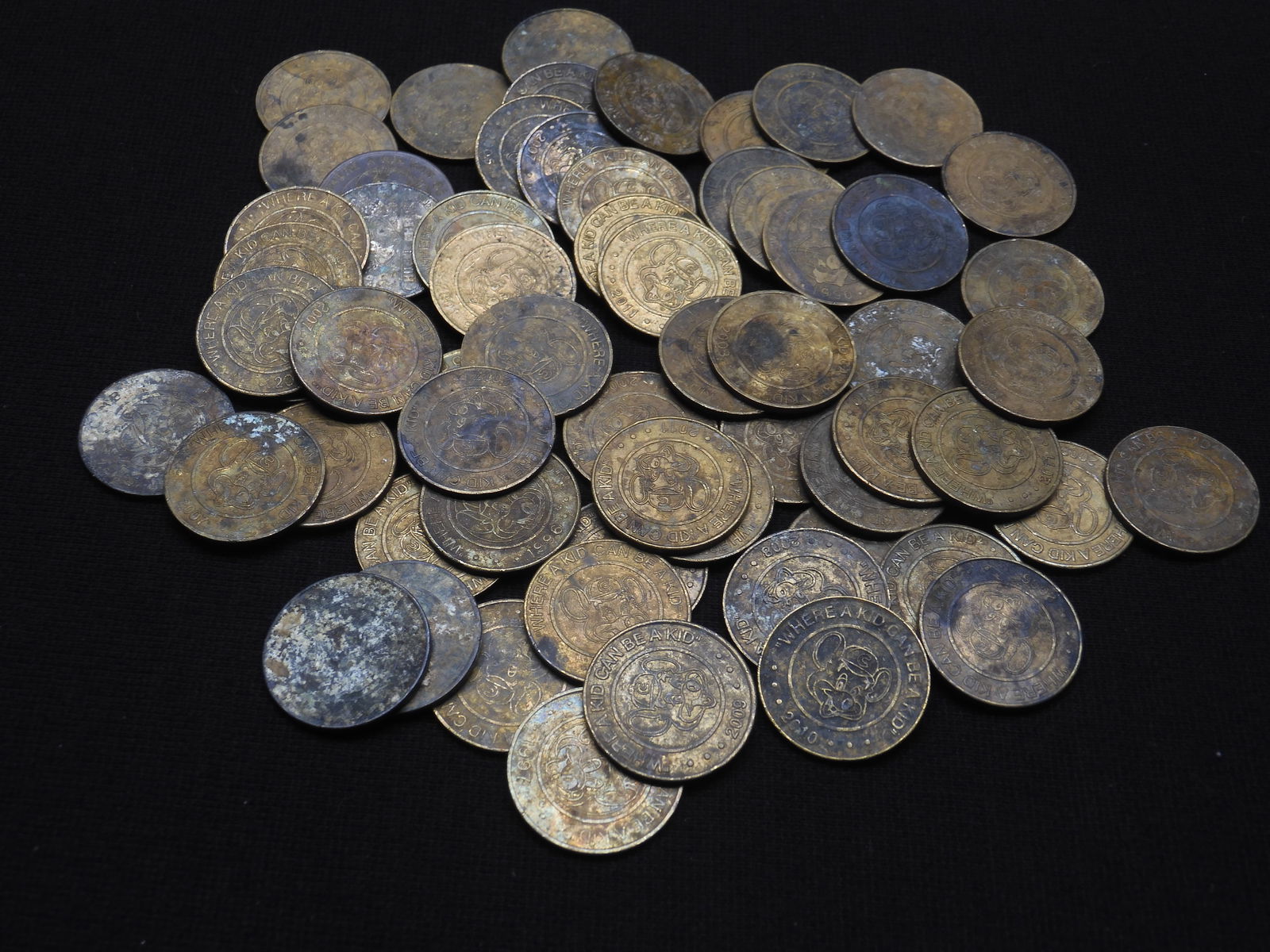 CHUCK E. CHEESE "WHERE A KID CAN BE A KID" TOKENS (QTY=64): CHUCK E. CHEESE "WHERE A KID CAN BE A KID" TOKENS (QTY=64)