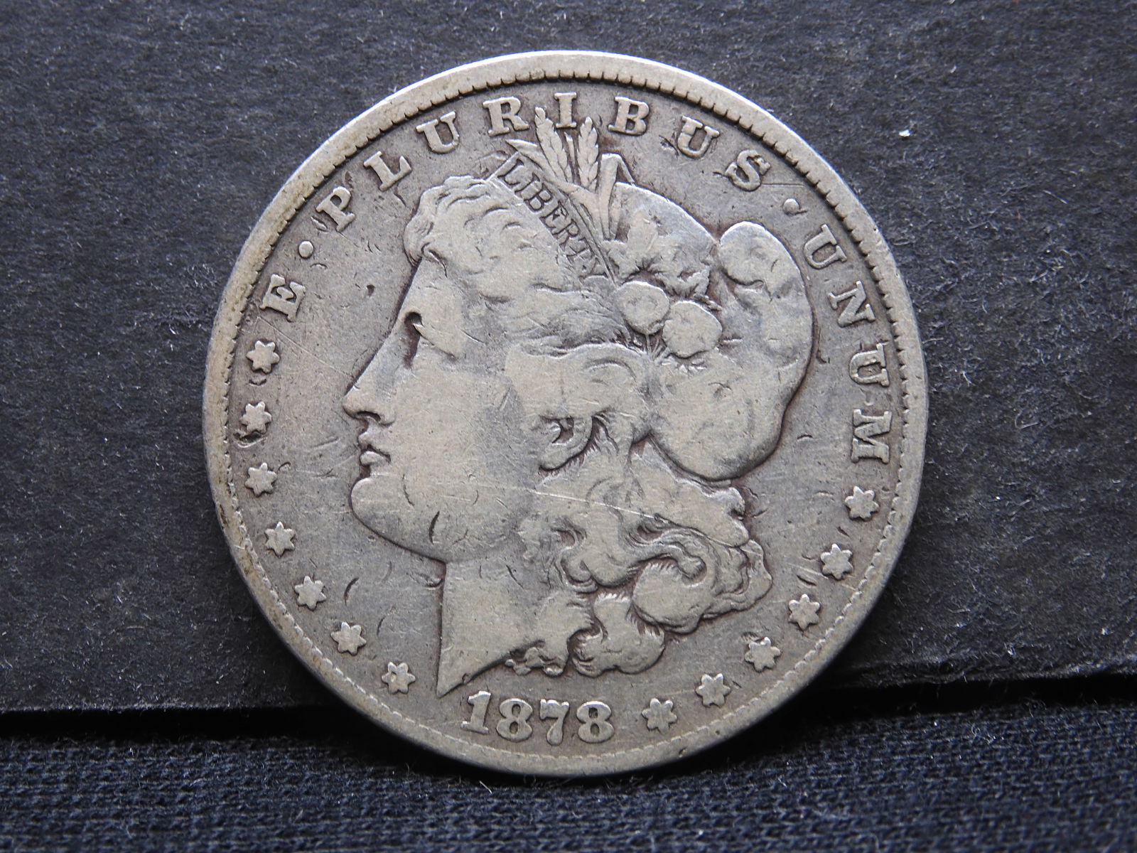 1878-P 7 Tail Feather Morgan Silver Dollar.  First Year Of Issue. (1 of 2)