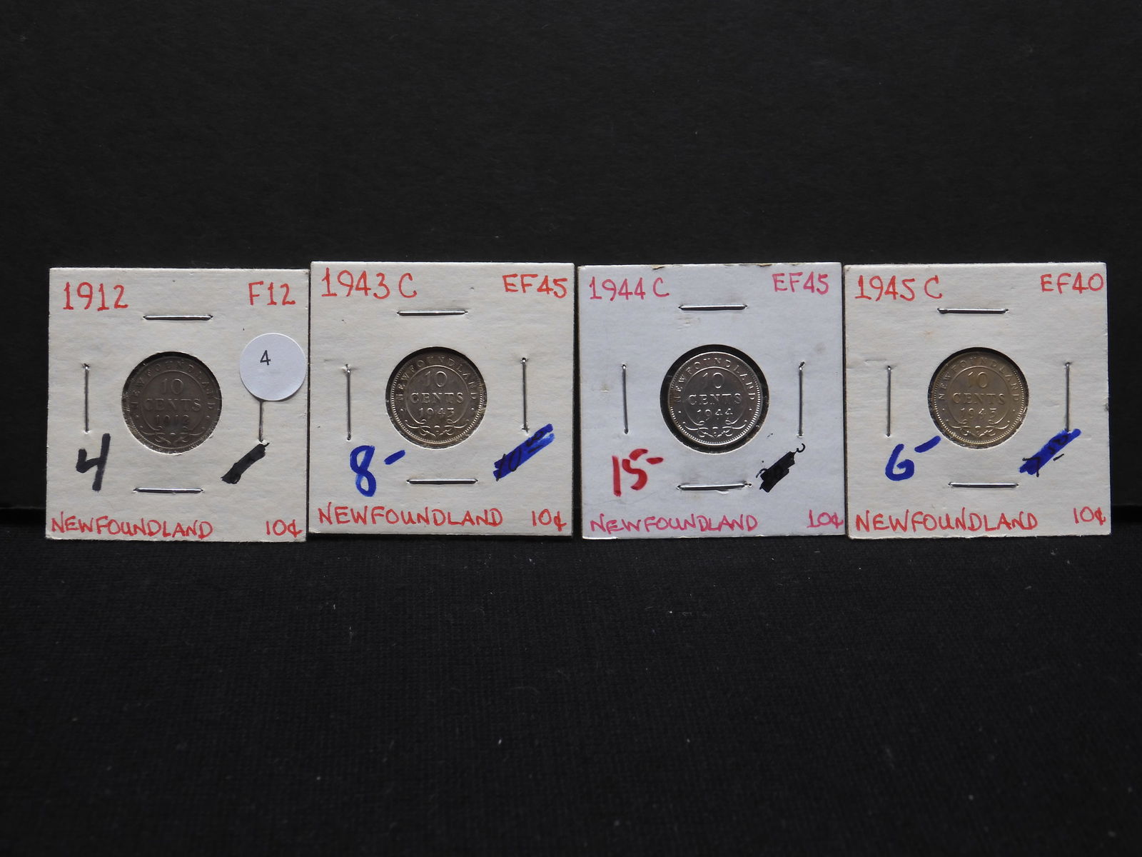 Four Newfoundland silver dimes. Nice condition. Old pricing at $33. (1 of 4)
