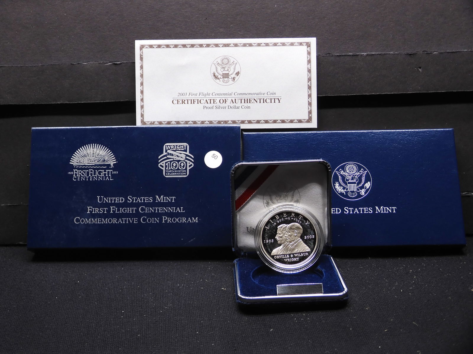 2003 P First Flight silver commemorative $1. GEM proof in original box plus COA. (1 of 4)