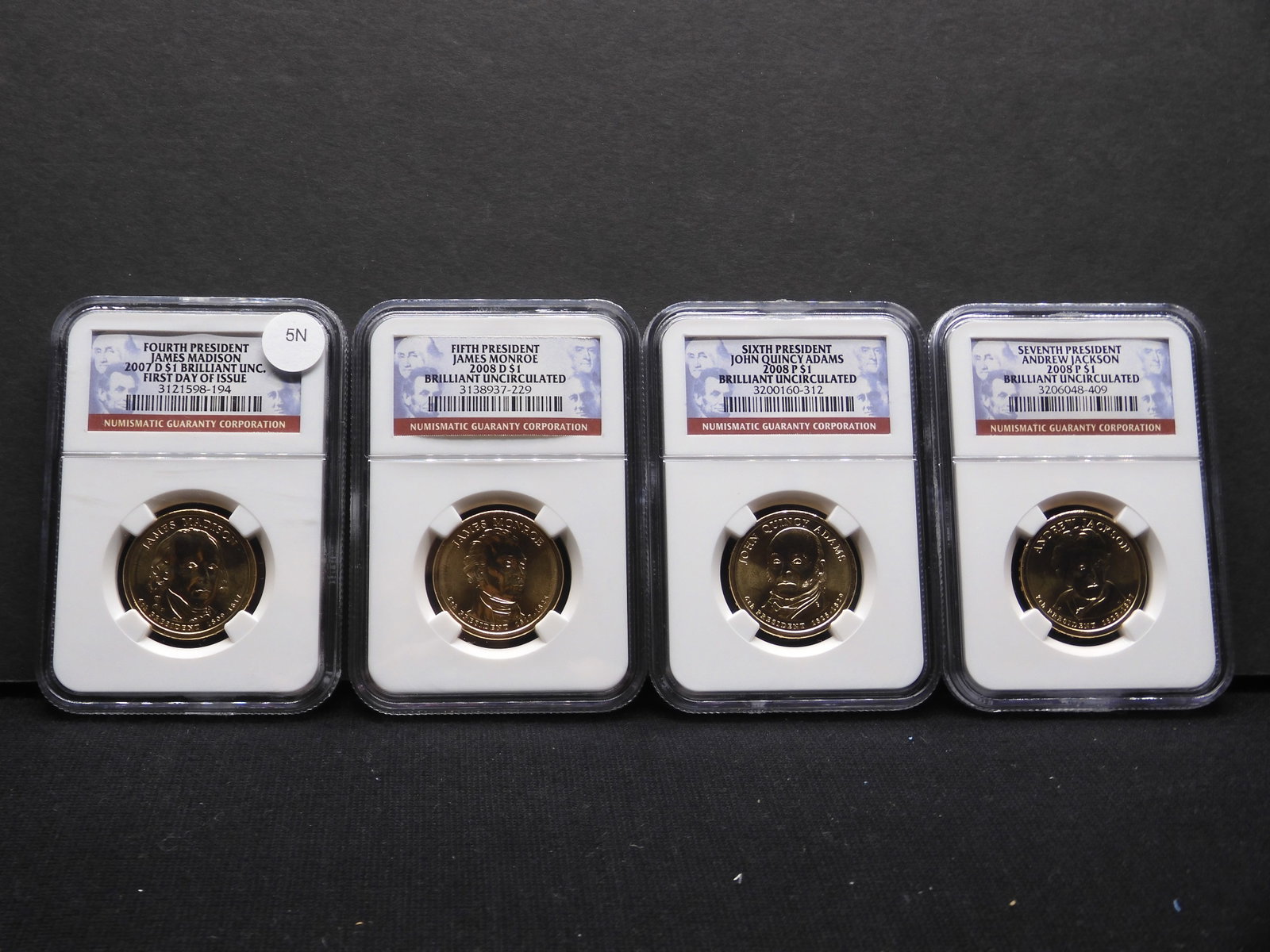 Four Brilliant Uncirculated First Day Of Issue 2007 & 2008 Presidential Dollars Graded By NGC: Four Brilliant Uncirculated First Day Of Issue 2007 & 2008 Presidential Dollars Graded By NGC Grading Co. 4th, 5th, 6th, & 7th Presidents. Madison, Monroe, Adams, Jackson.