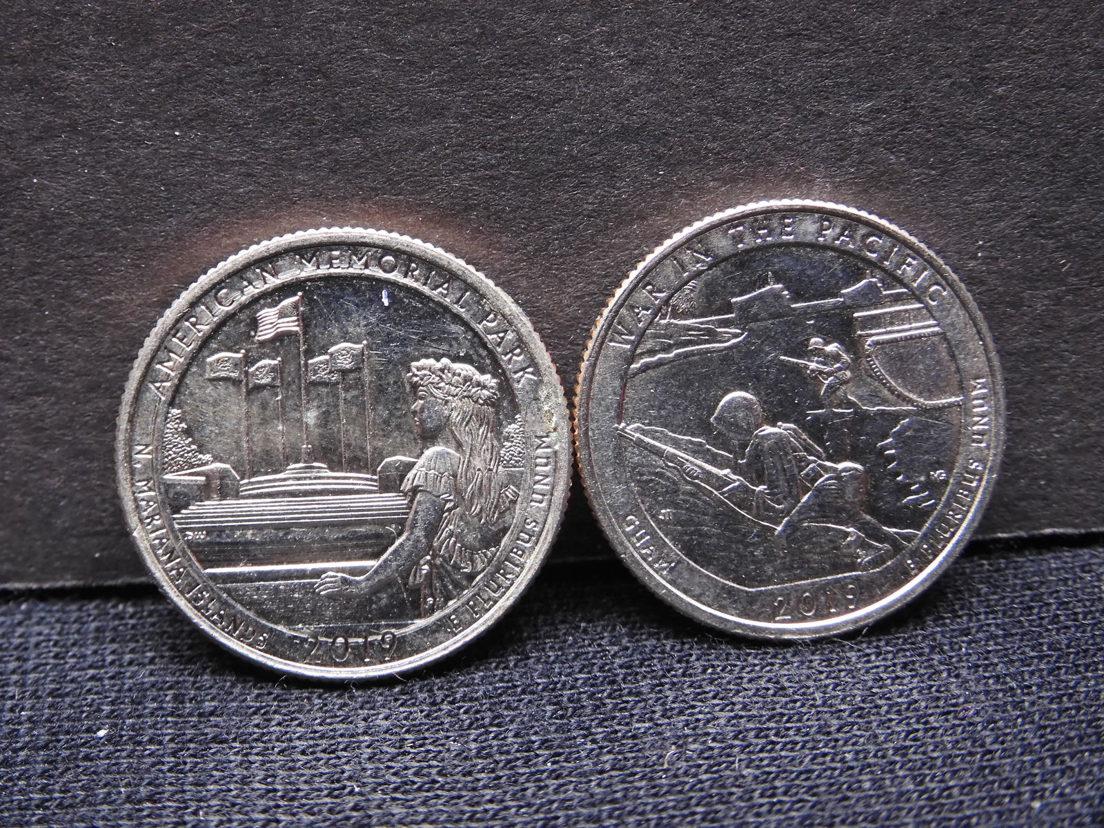 Two 2019 W Washington Quarters: War in Pacific and American Memorial. (1 of 3)