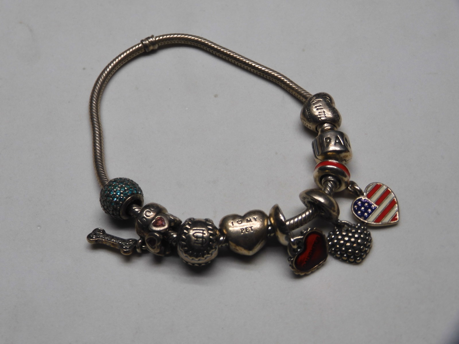 Pandora Sterling Bracelet. Weighs 1.4 TOZ with 8 Charms. 8 inches.: Pandora Sterling Bracelet. Weighs 1.4 TOZ with 8 Charms. 8 inches.