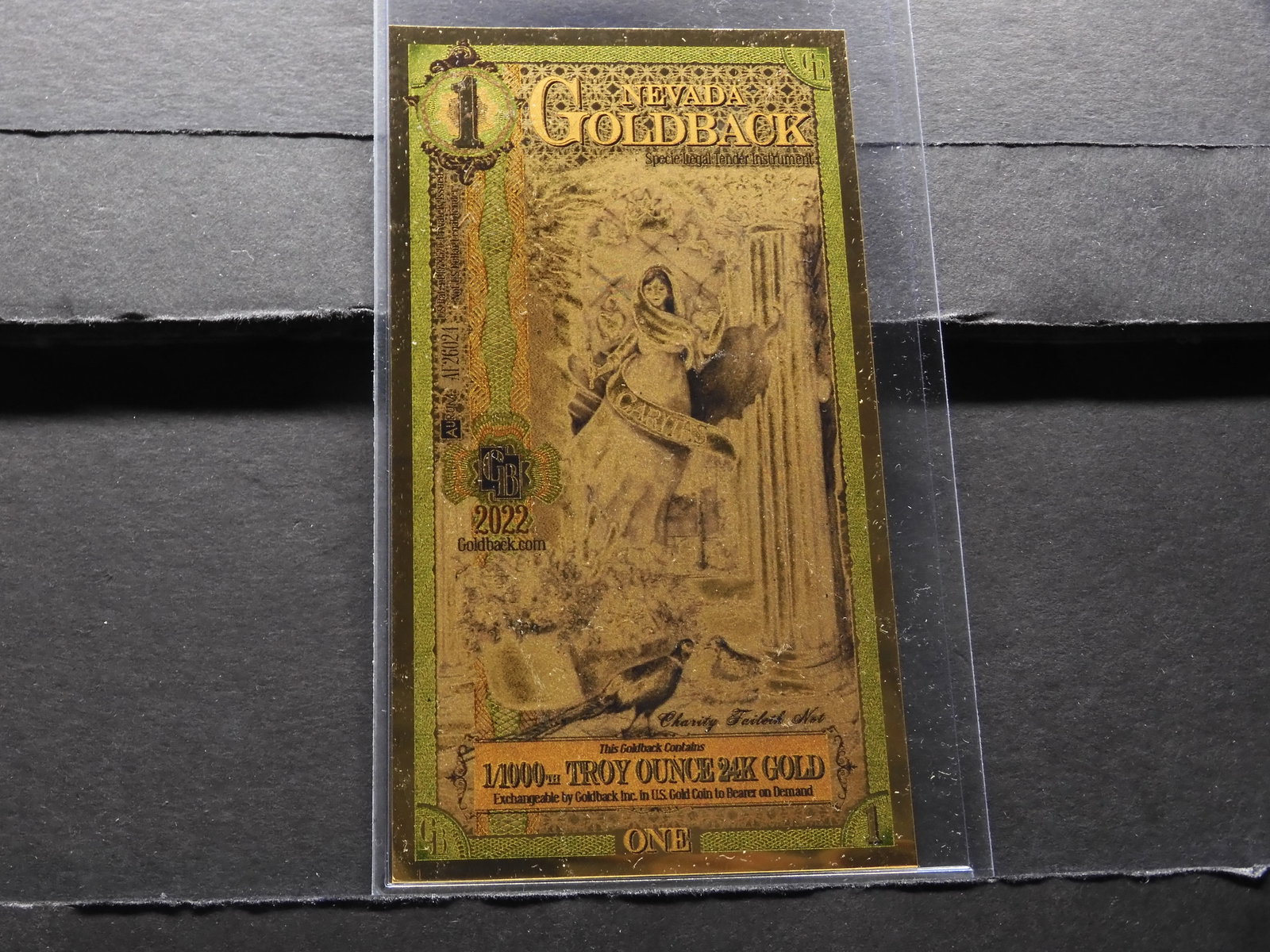 1/1000th Troy Oz. 24K GOLD 2022 $1 Nevada Gold back (1 of 2)