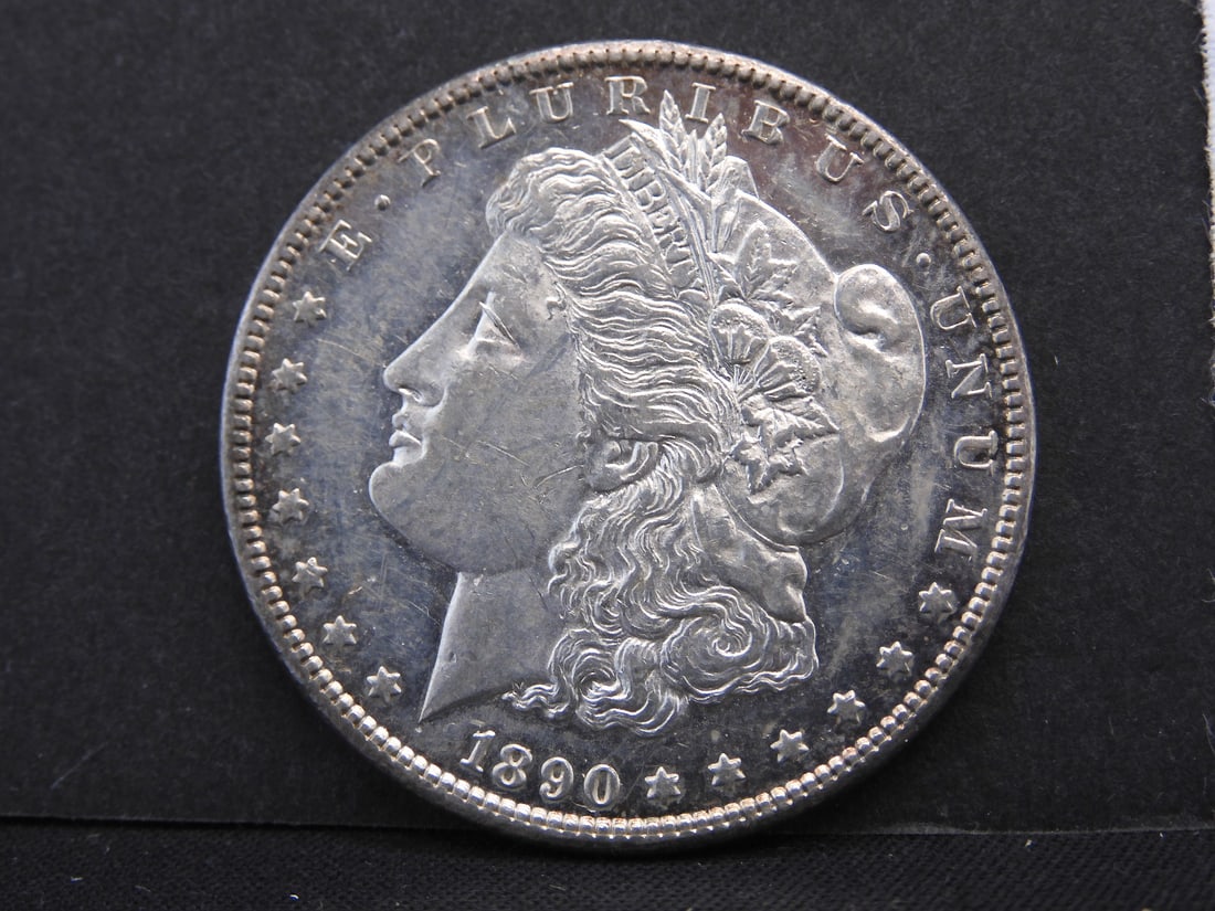 1890-CC Morgan $1. AU plus with proof like surfaces and luster. Scarce. (1 of 4)