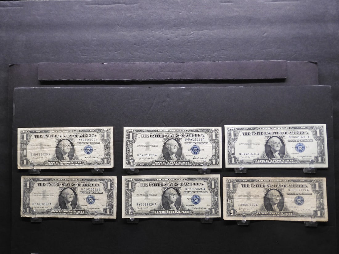 Six nice 1957 $1 silver certificates: (2) 57, (2) 57 A and (2) 57 B (1 of 4)