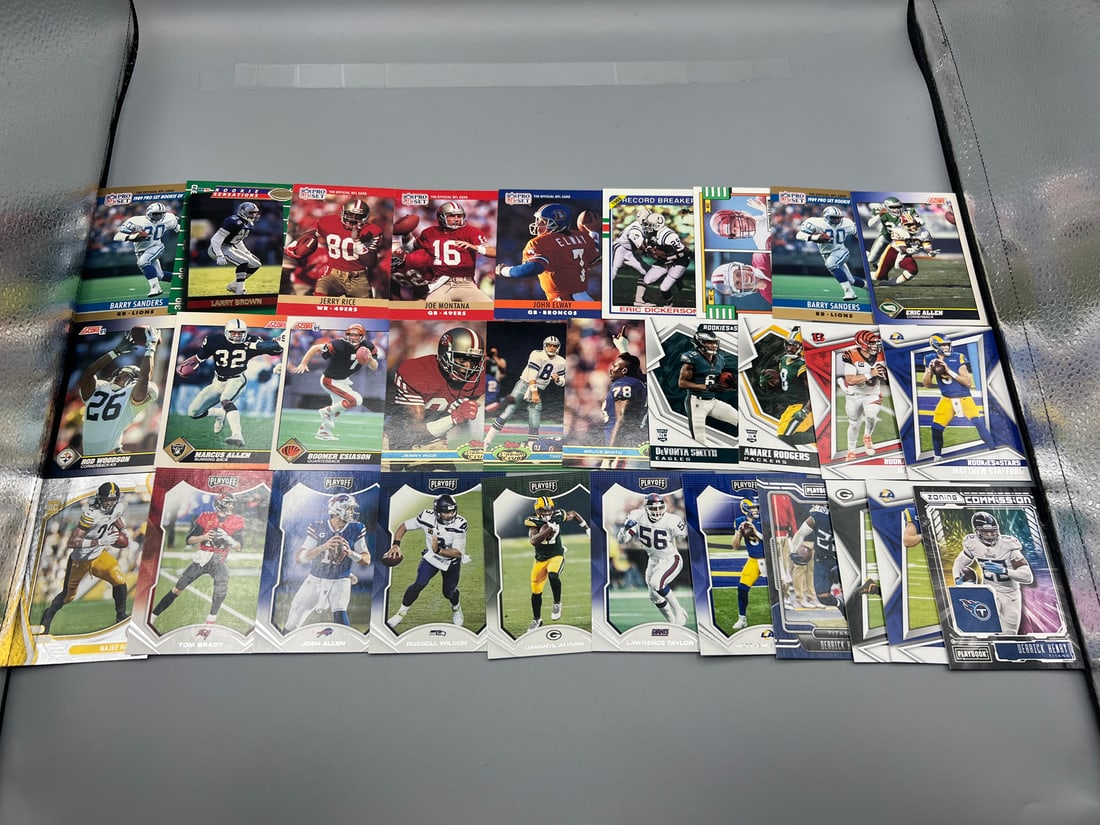Lot of (30) Assorted Football Star Player Cards - Varying Conditions - Barry Sanders, Jerry Rice,: Lot of (30) Assorted Football Star Player Cards - Varying Conditions - Barry Sanders, Jerry Rice, Joe Burrow