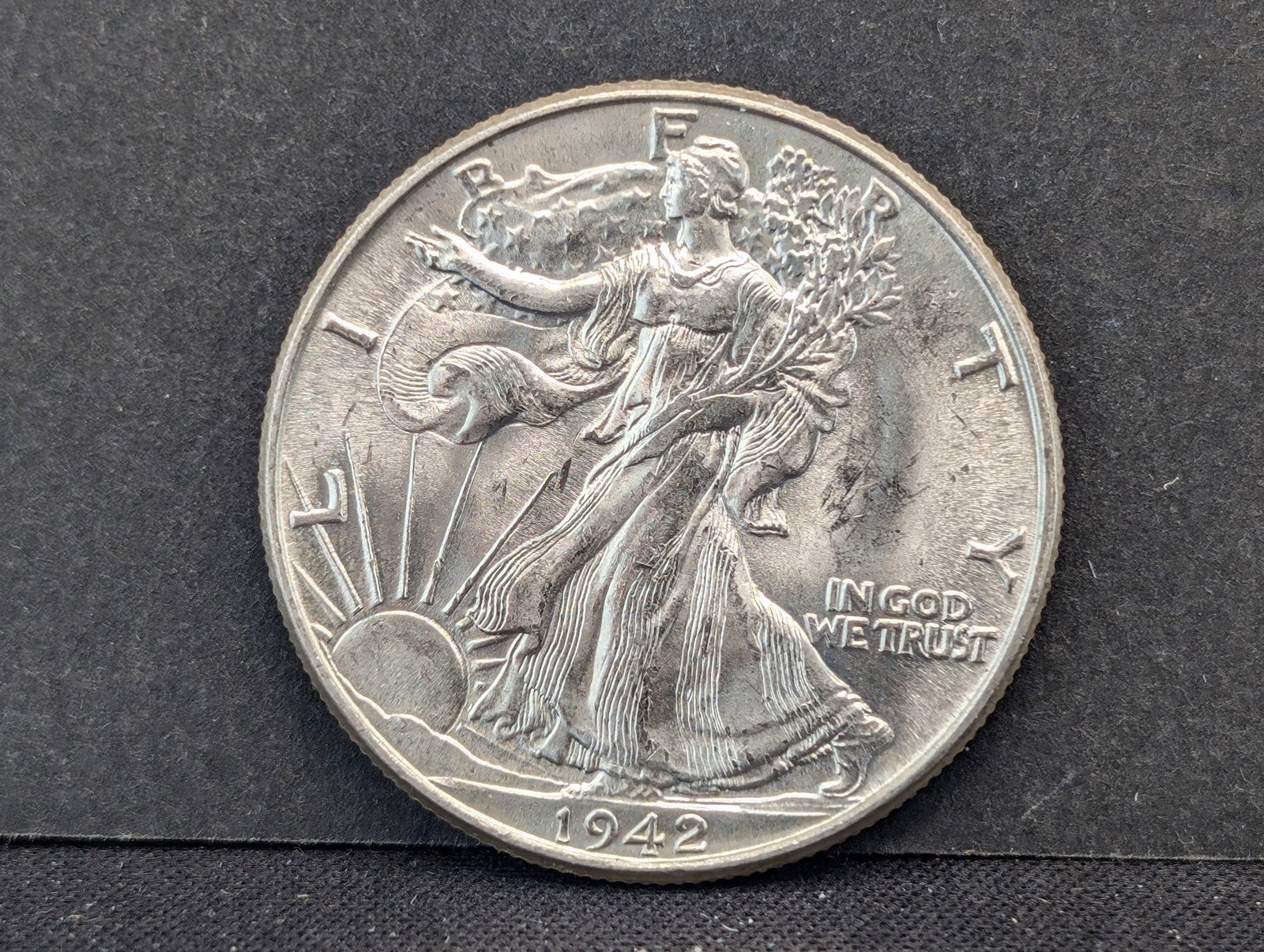 1942 Walking Liberty Half. Very choice BU from original roll. Great luster.: 1942 Walking Liberty Half. Very choice BU from original roll. Great luster.