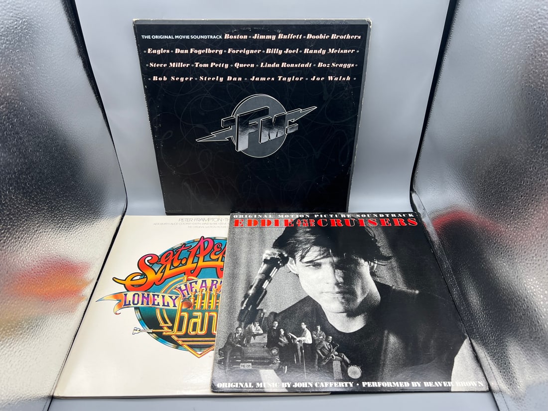 Three (3) Original Movie Soundtrack LPs: FM (1978) 2 LPs, gatefold; Sgt. Peppers Lonely Hearts Club: Three (3) Original Movie Soundtrack LPs: FM (1978) 2 LPs, gatefold; Sgt. Peppers Lonely Hearts Club Band (1978), 2 LPs, gatefold; and Eddie and the Cruisers (1983)