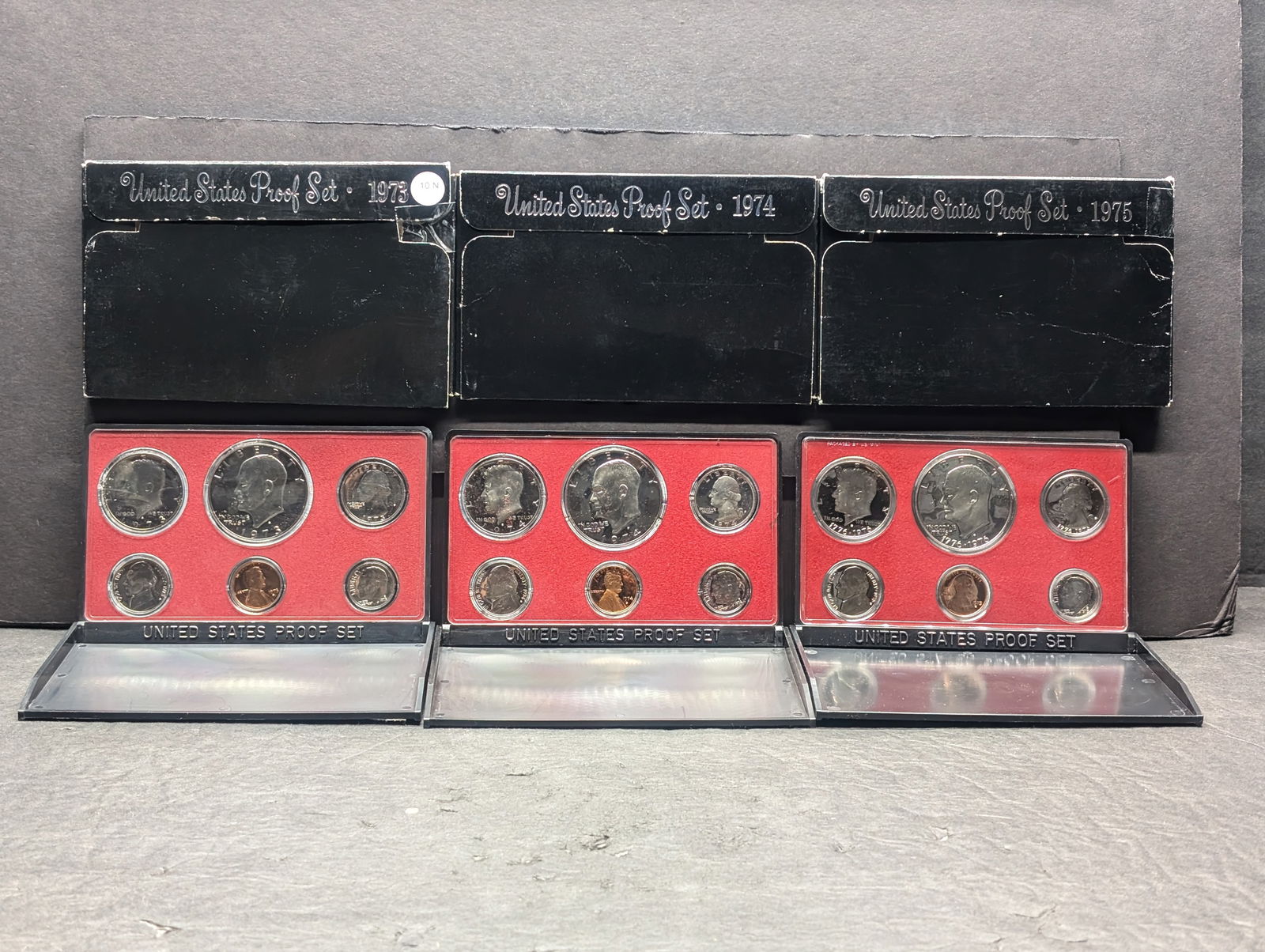 1973-S 1974-S 1975-S United States Proof Sets With Original Gov't Packaging. 18 Coins.: 1973-S 1974-S 1975-S United States Proof Sets With Original Gov't Packaging. 18 Coins.