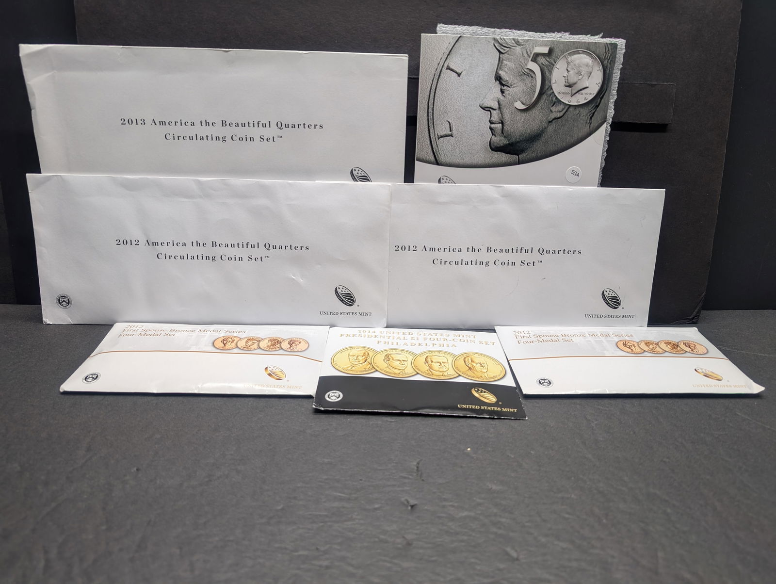 Bag of US Mint Products: 2014 P Presidential $1 set, 2  2012- 4 piece First Spouse Bronze Medal (1 of 10)